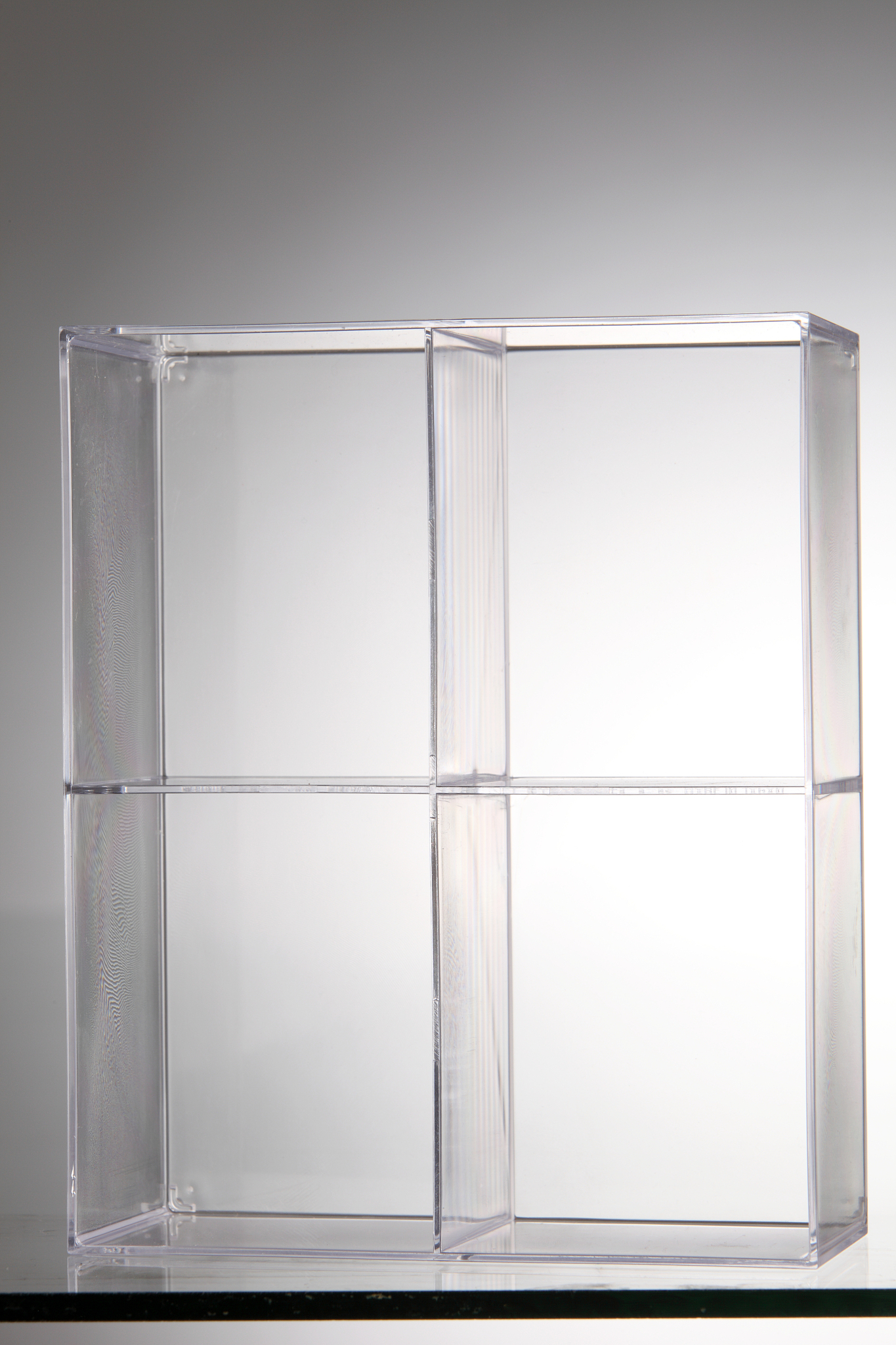 close-up of glass box over gray background