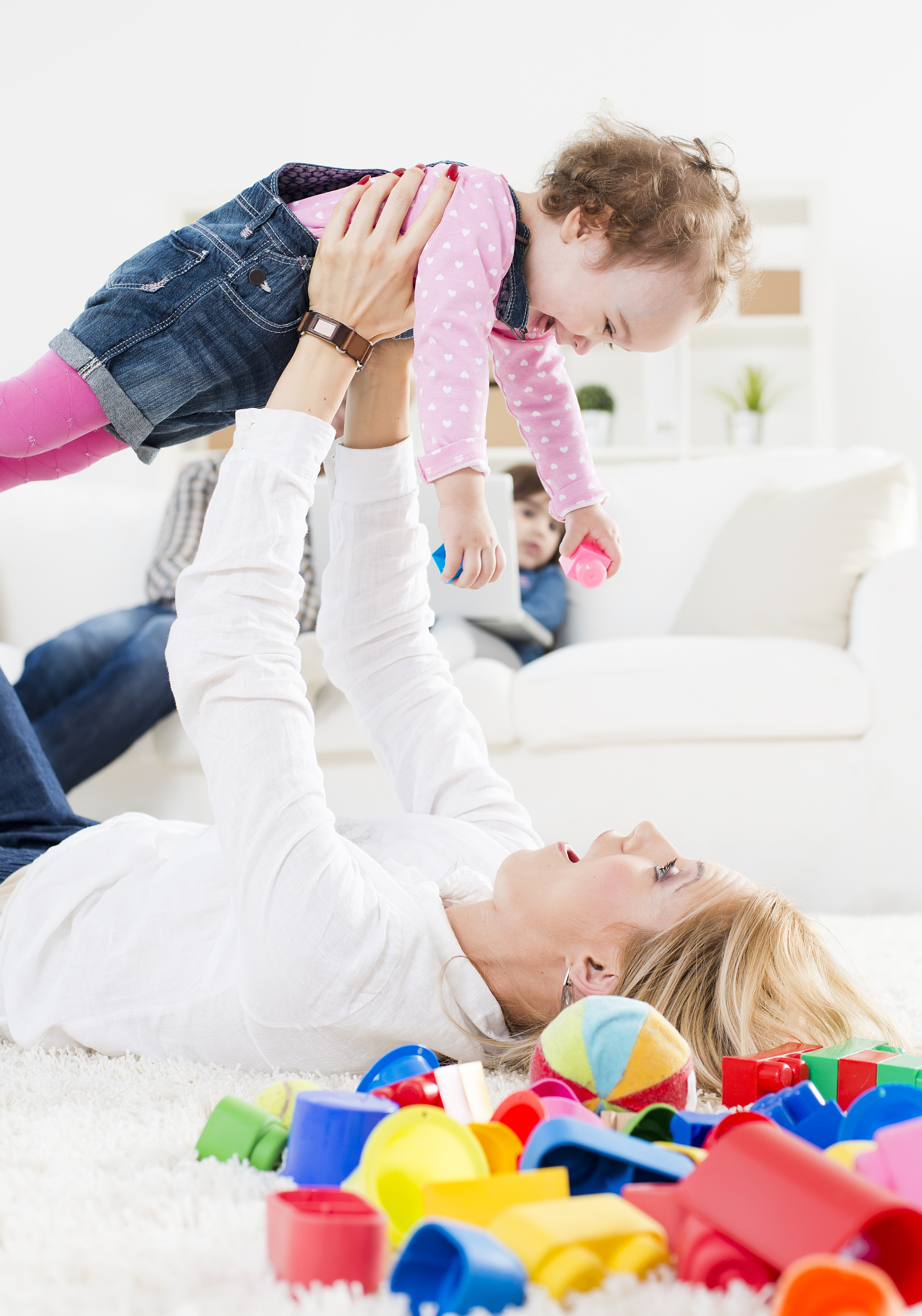 mother playing with baby
