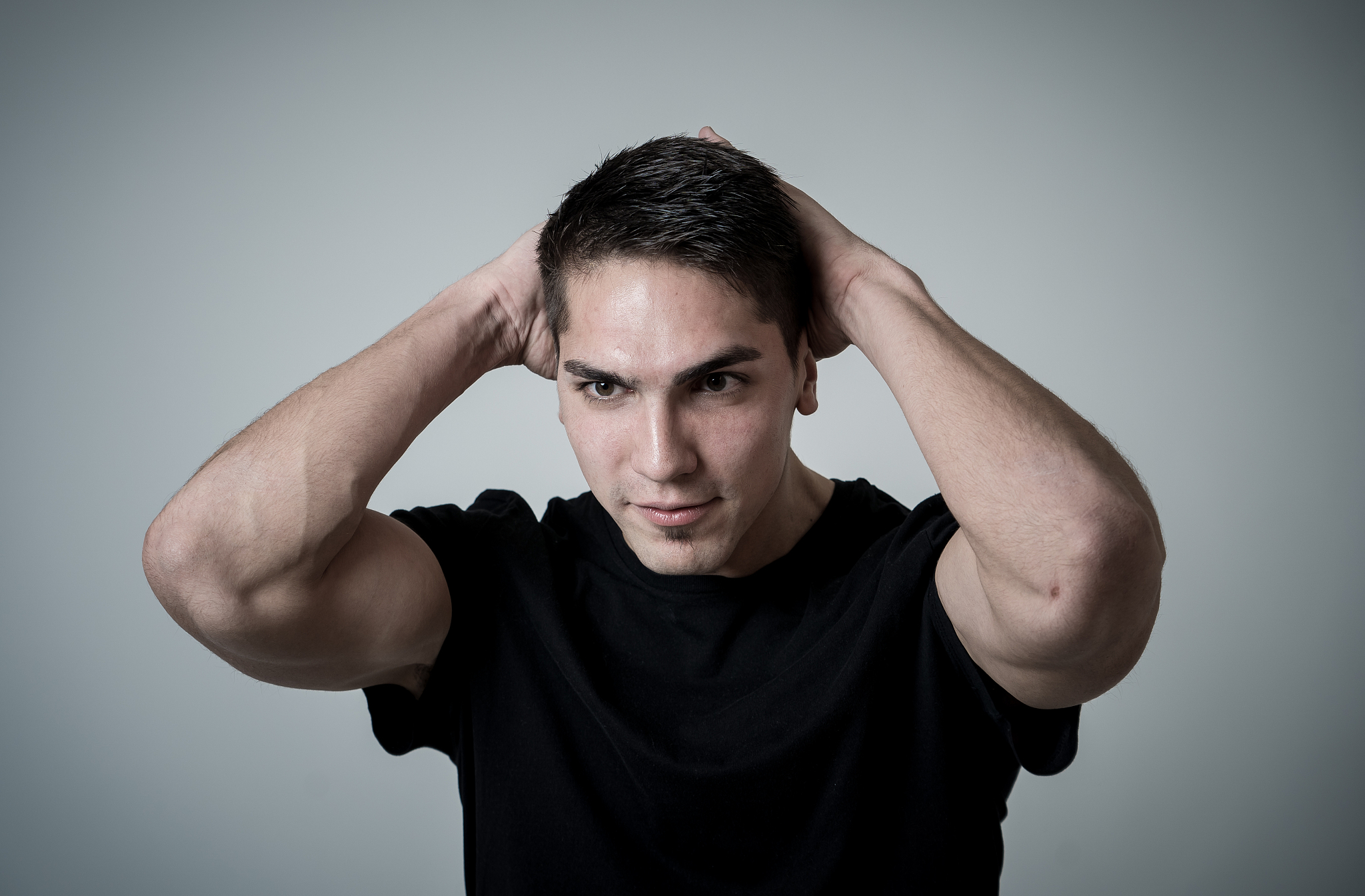 portrait of frustrated mixed race young man with angry and stres