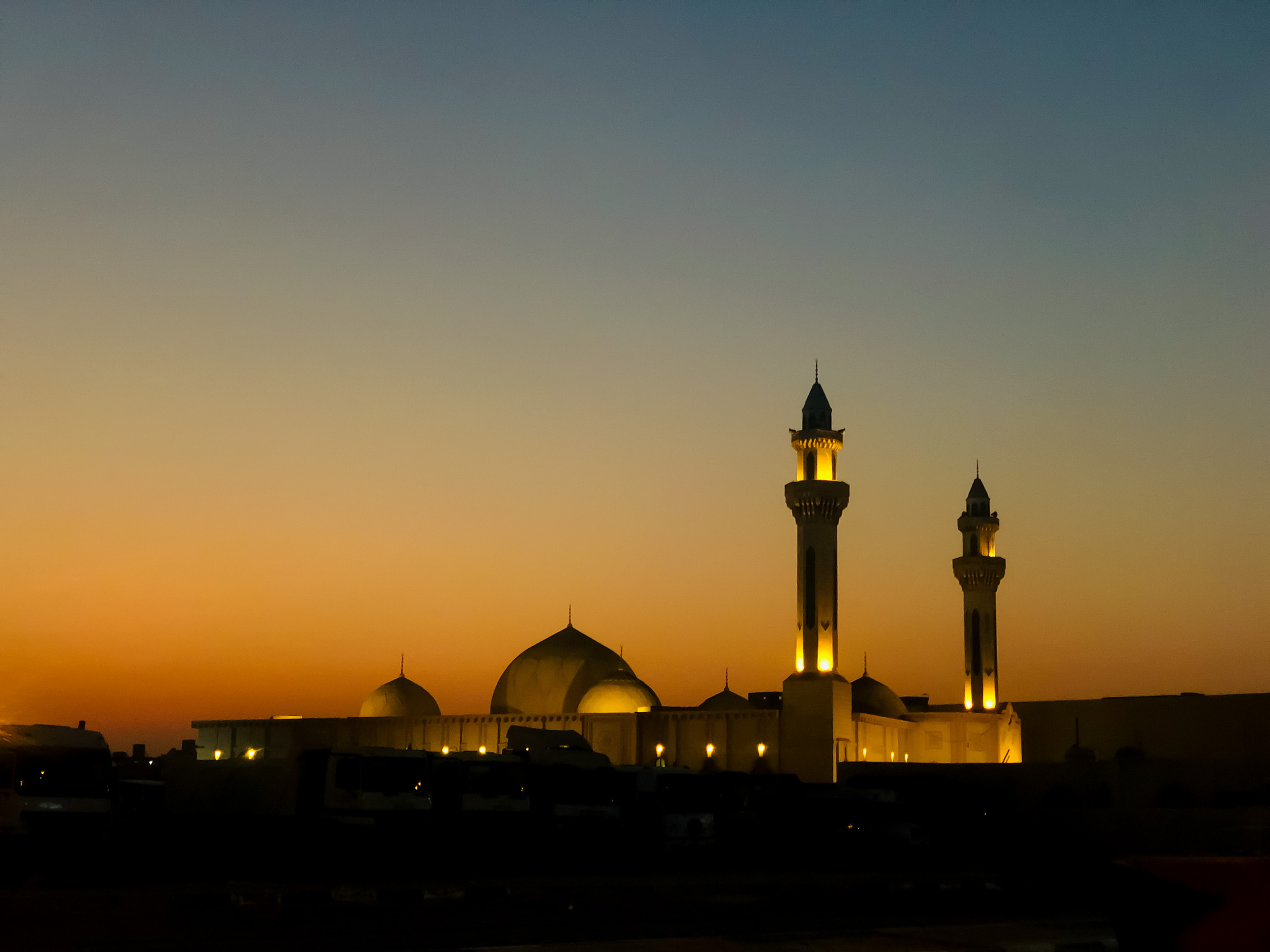 a mosque on sunset sky background