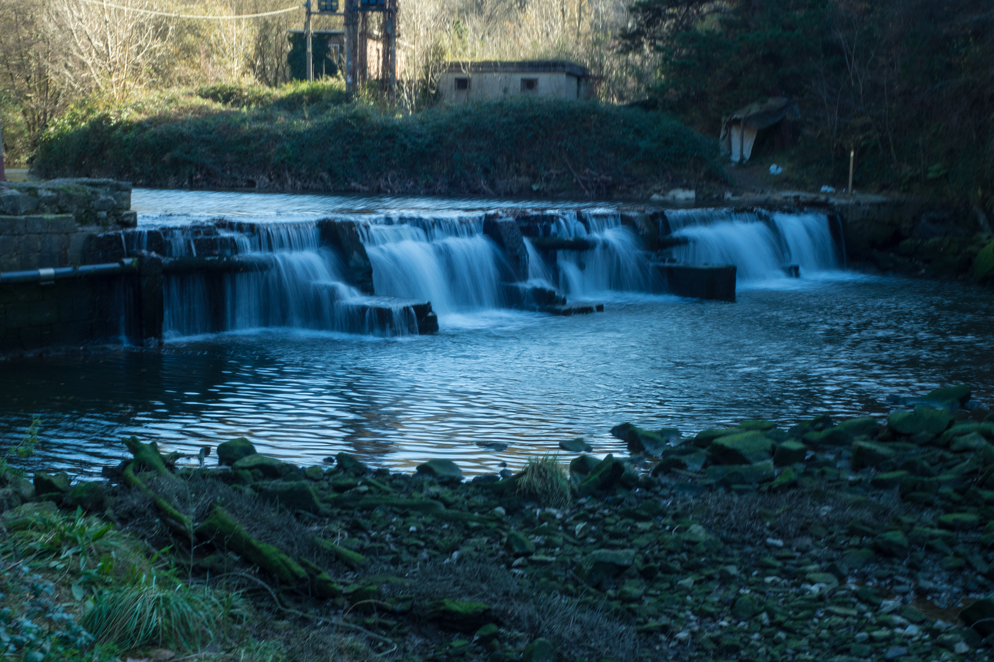 little waterfall in butron river in the basque country, spain