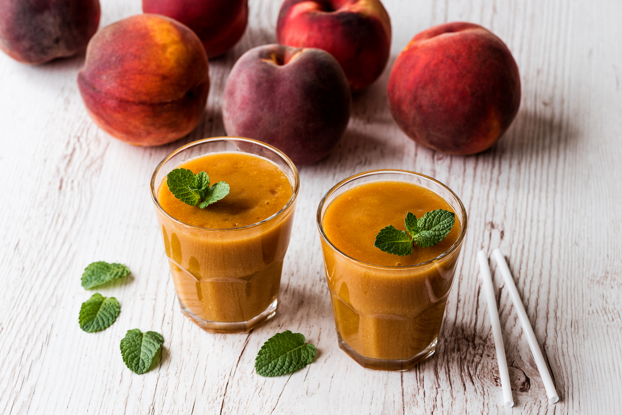 healthy beverage - fresh blended peach smoothie with mint