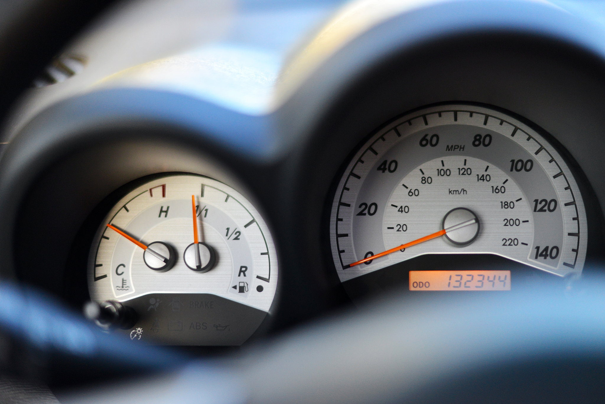 speedometer, fuel and temperature gauges in a car