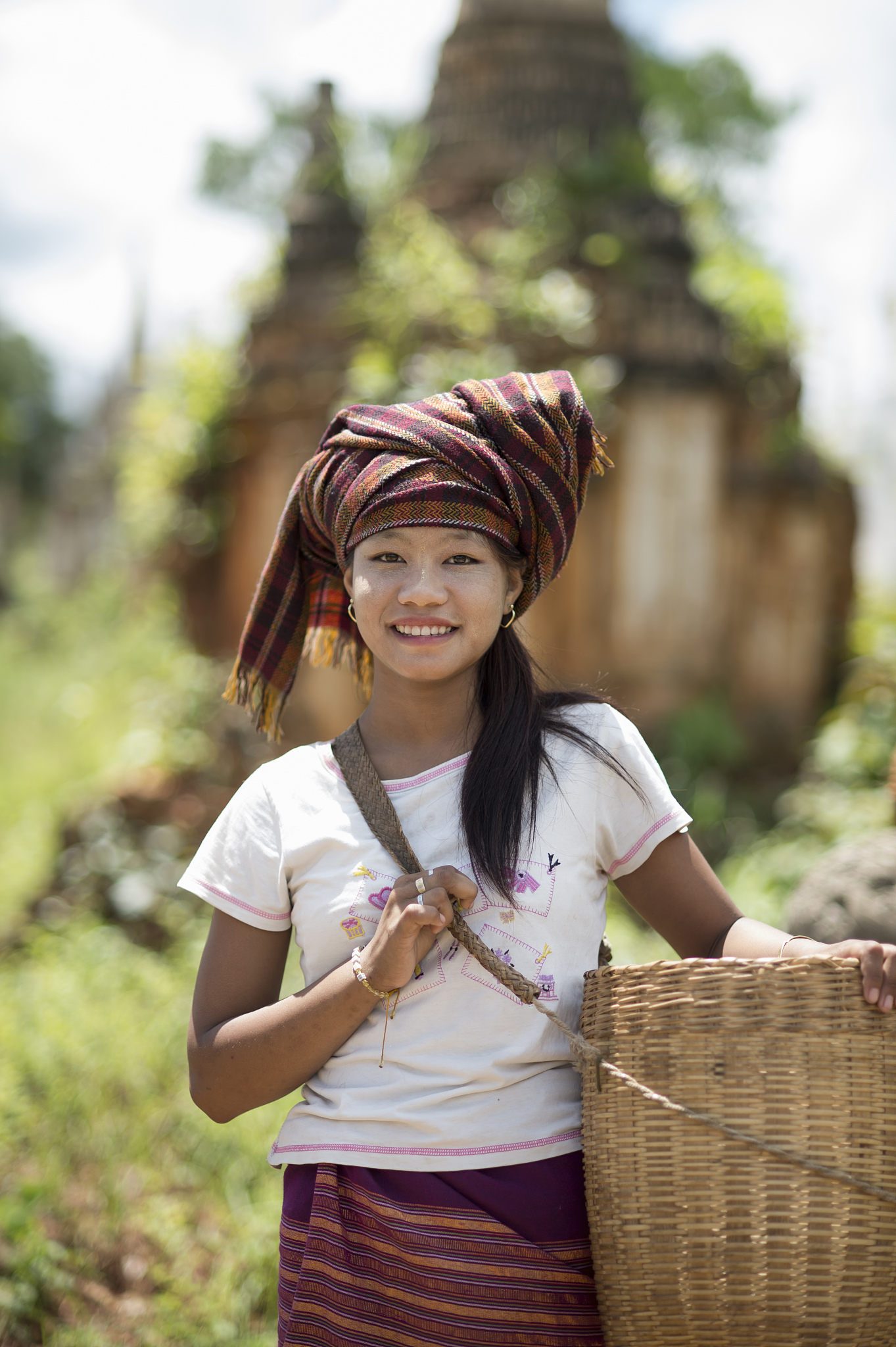 teenage girl wearing headscarf carrying basket, inle lake, burma