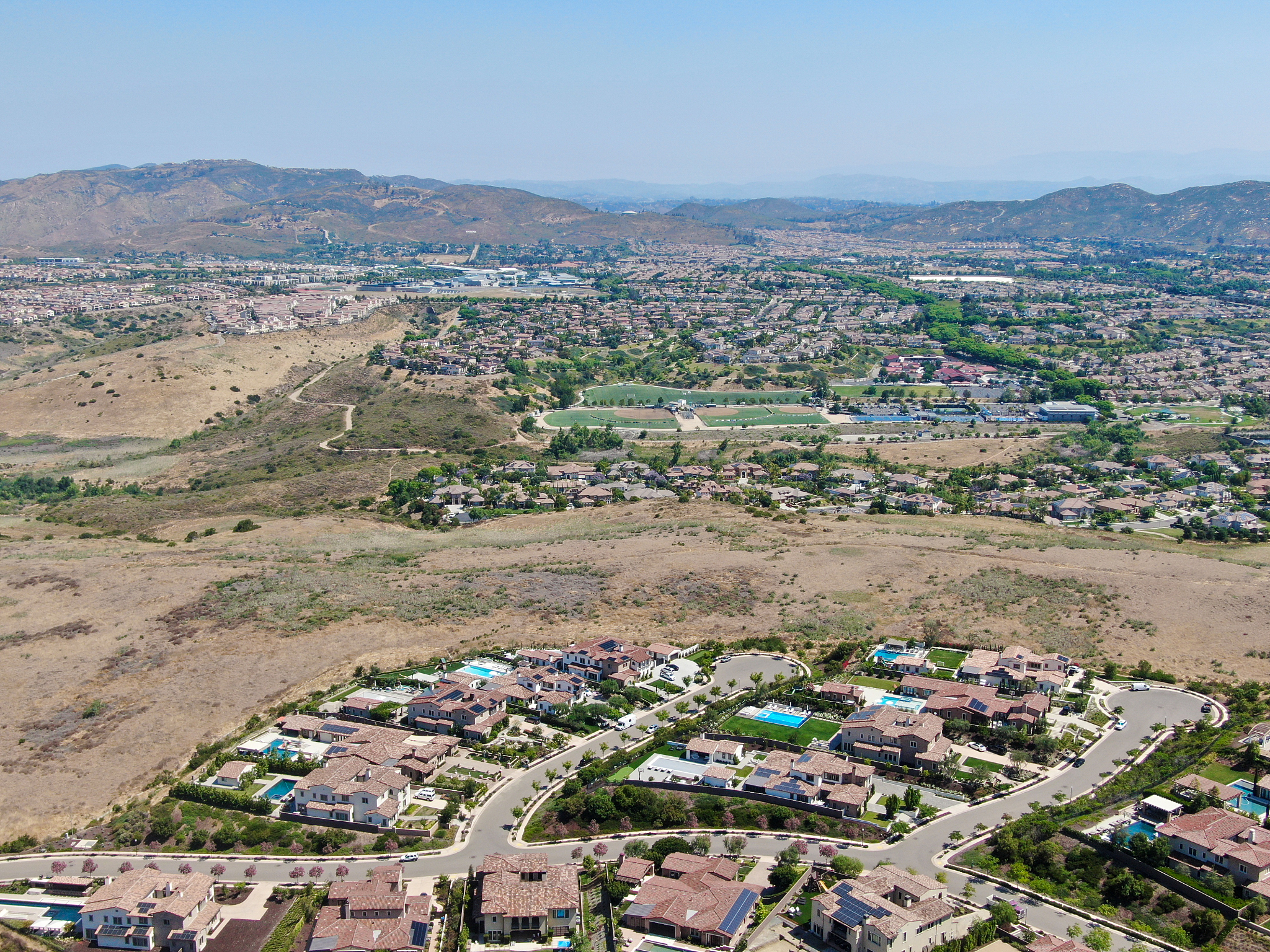 aerial view of high class neighborhood with residential villas a