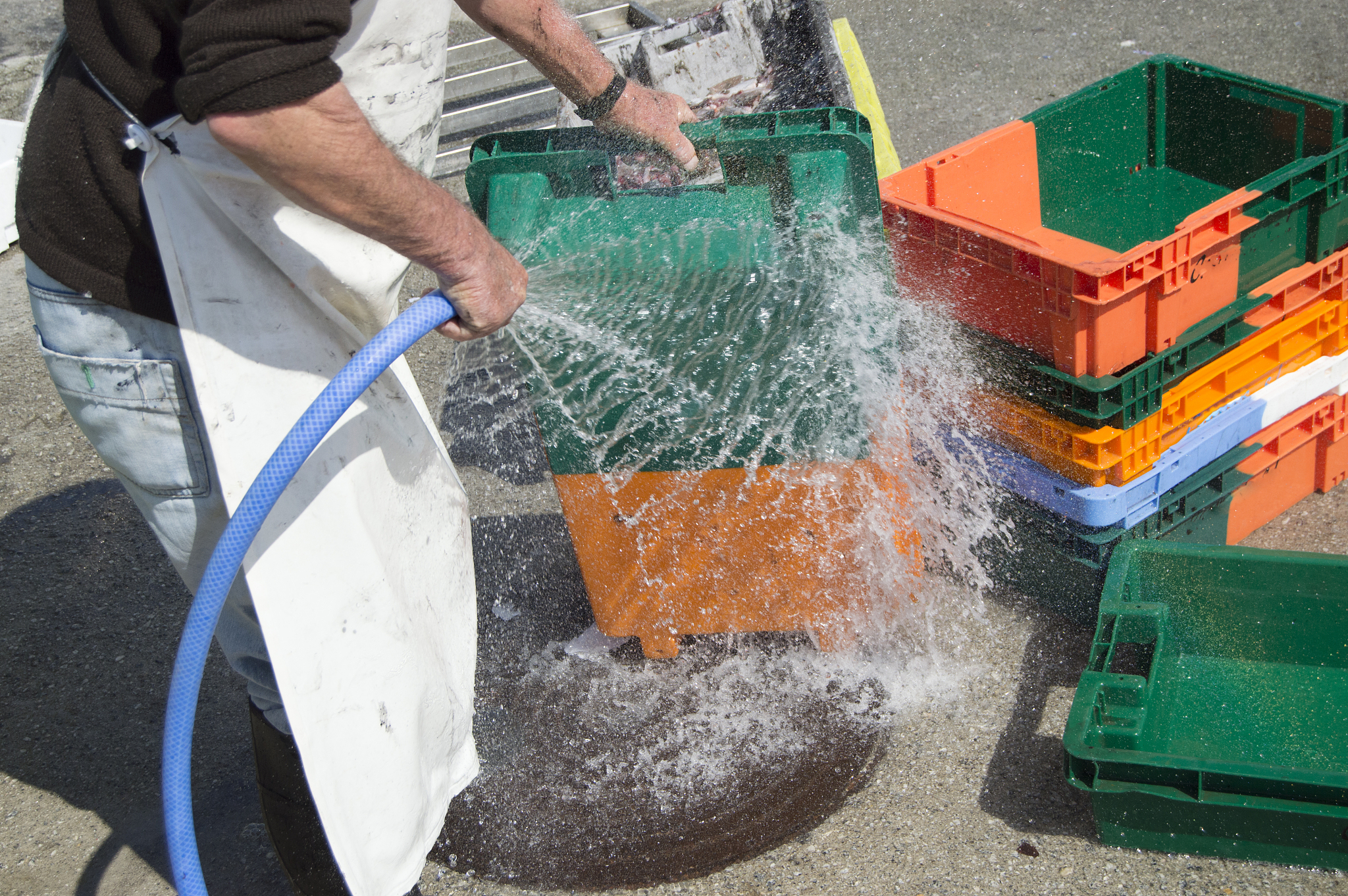 washing boxes with a gosepipe
