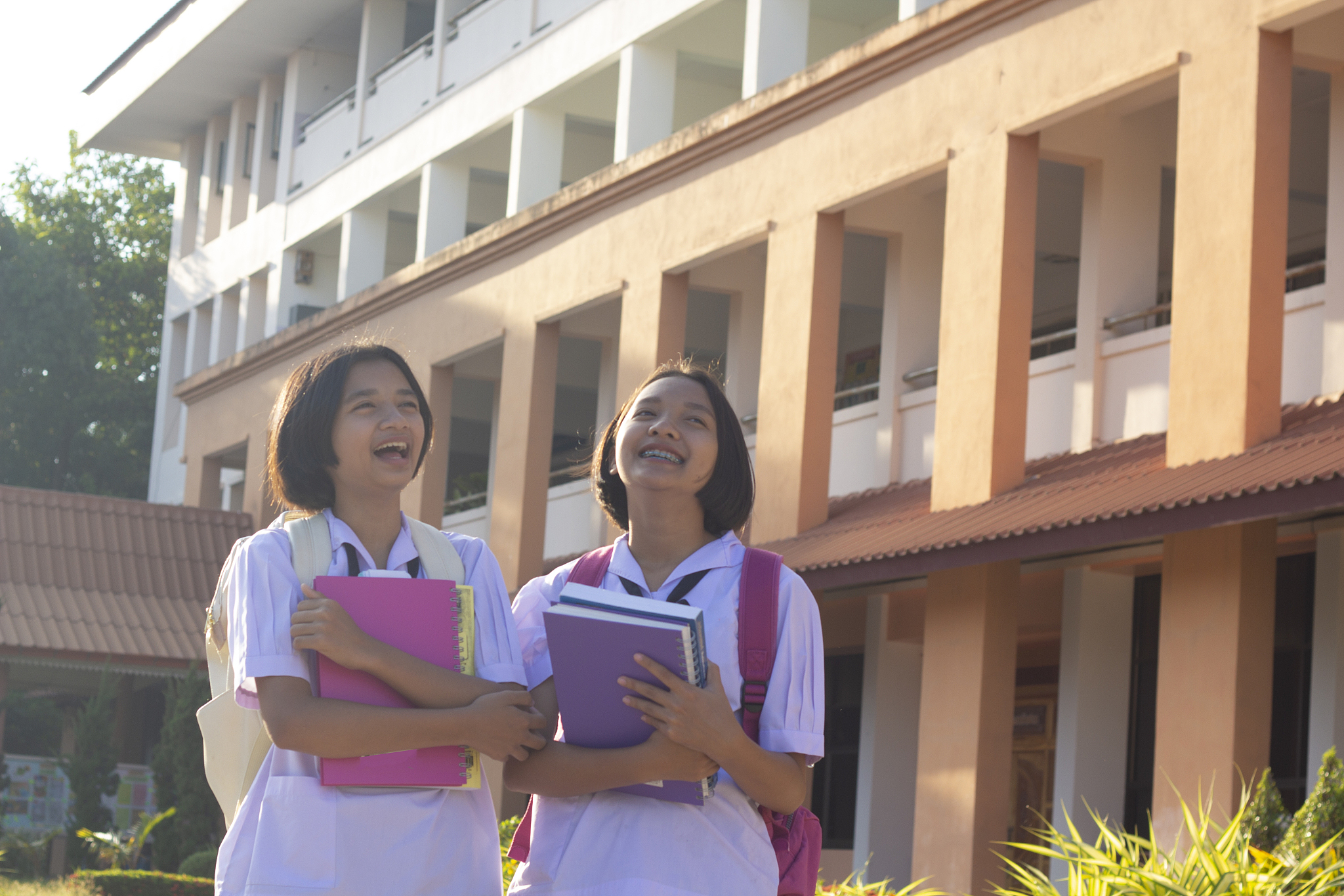 happy young asian girl at school with uniform.