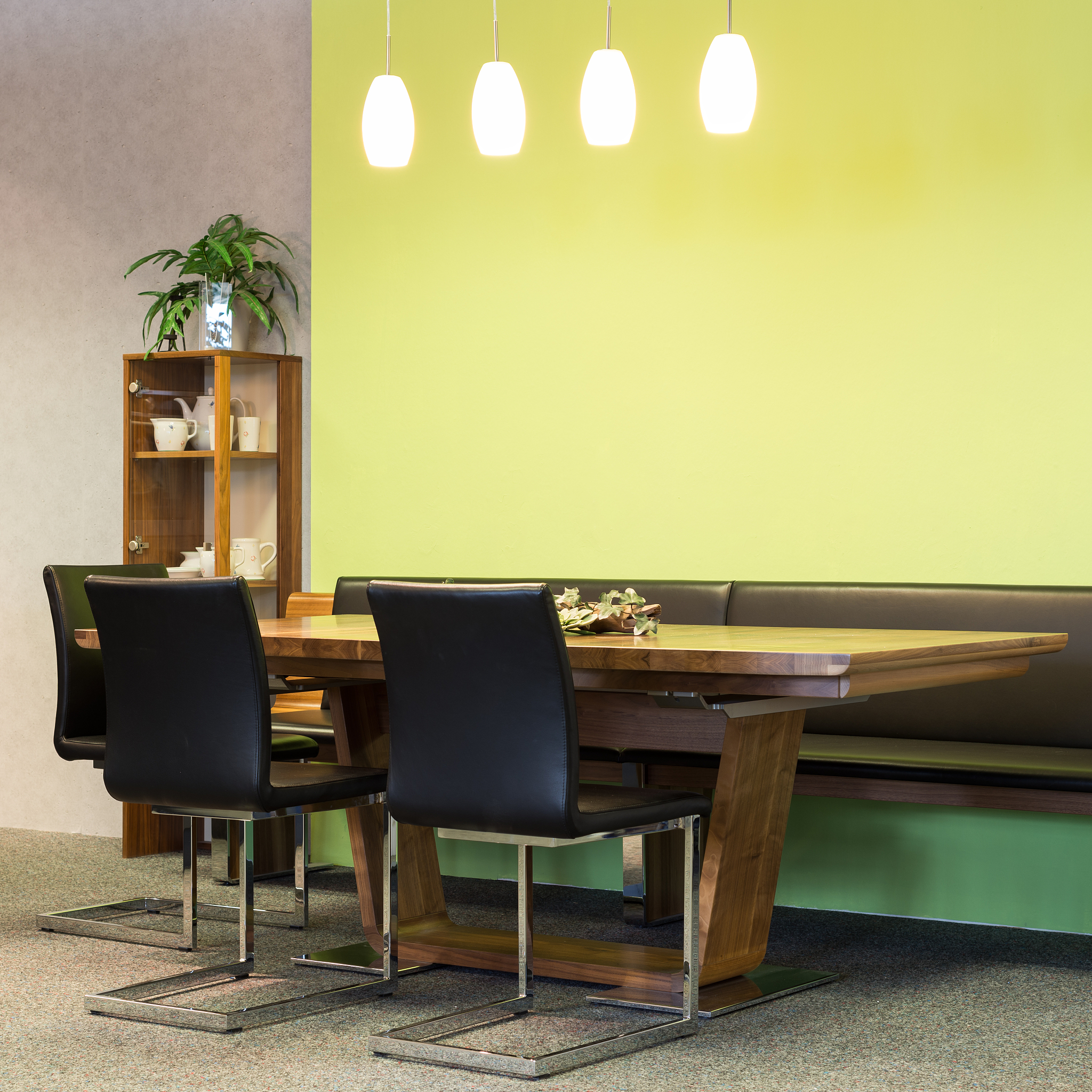 view to wooden table with leather chairs in dining room
