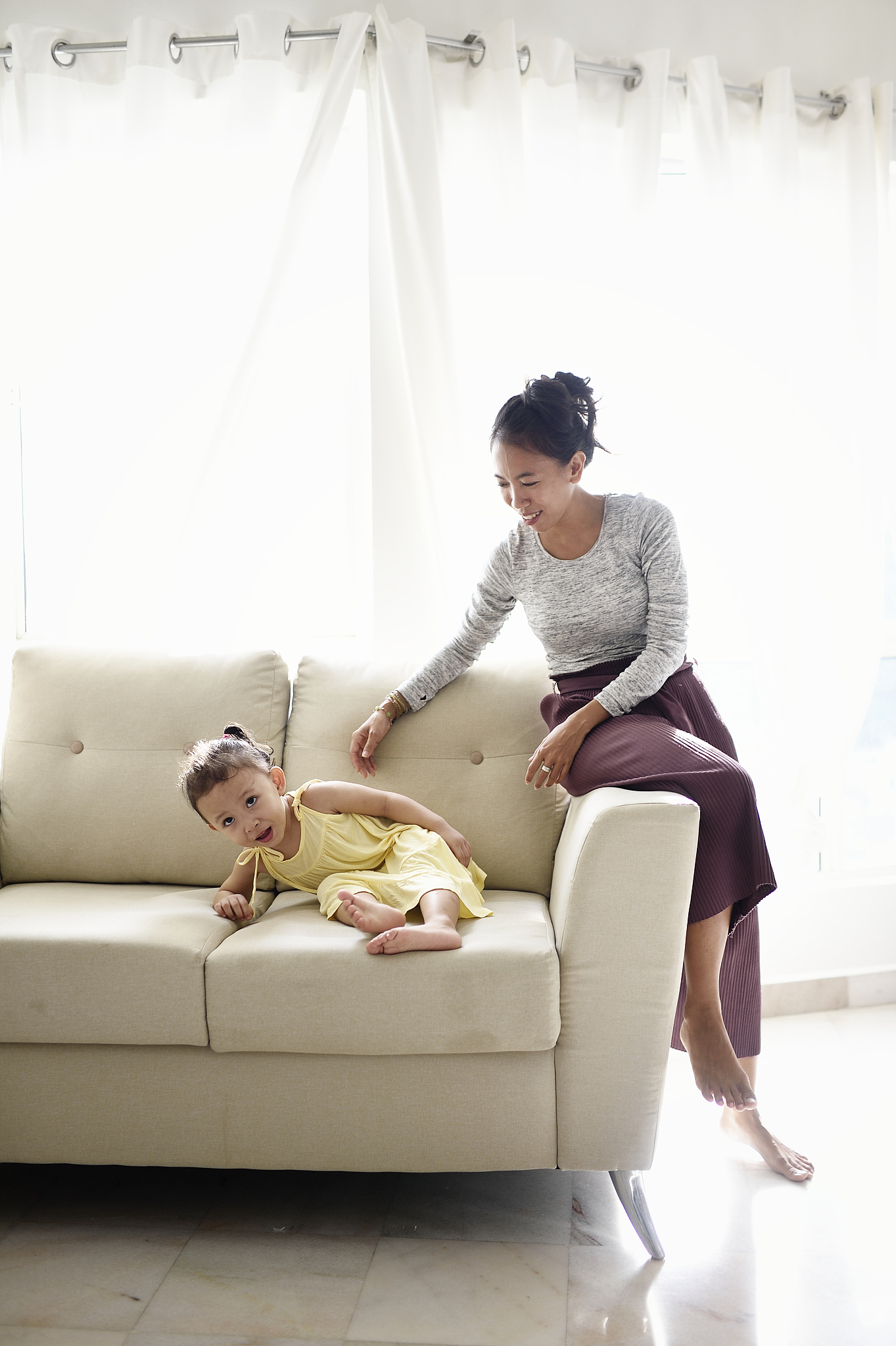 malaysian woman and her niece at home