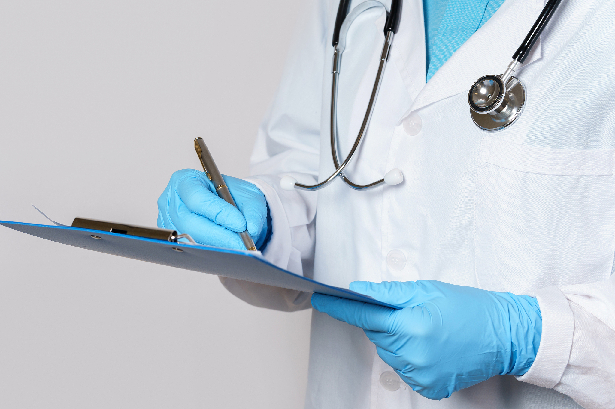 doctor filling a medical report