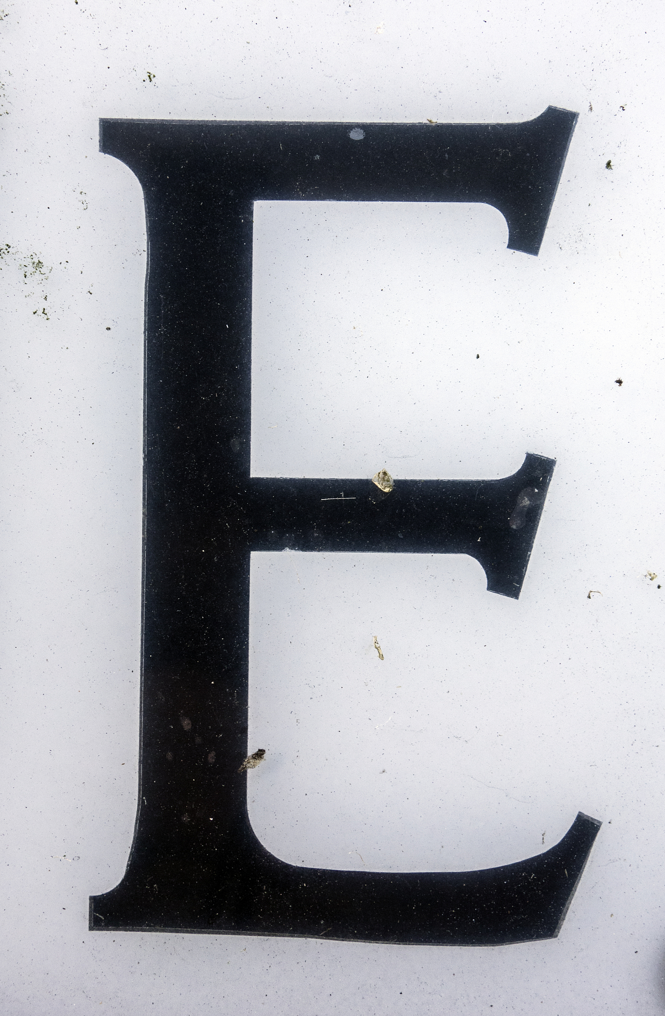 written wording in distressed state typography found letter e