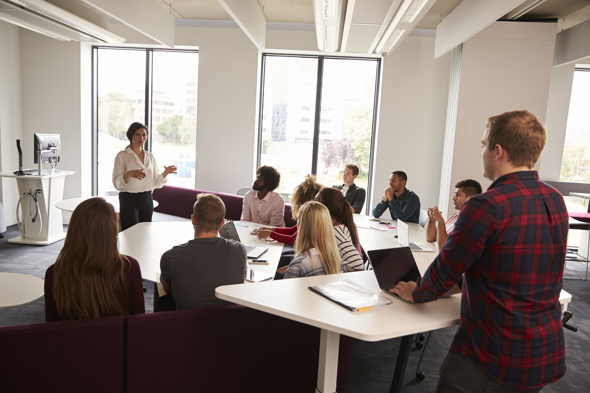 group of university students attending lecture on campus