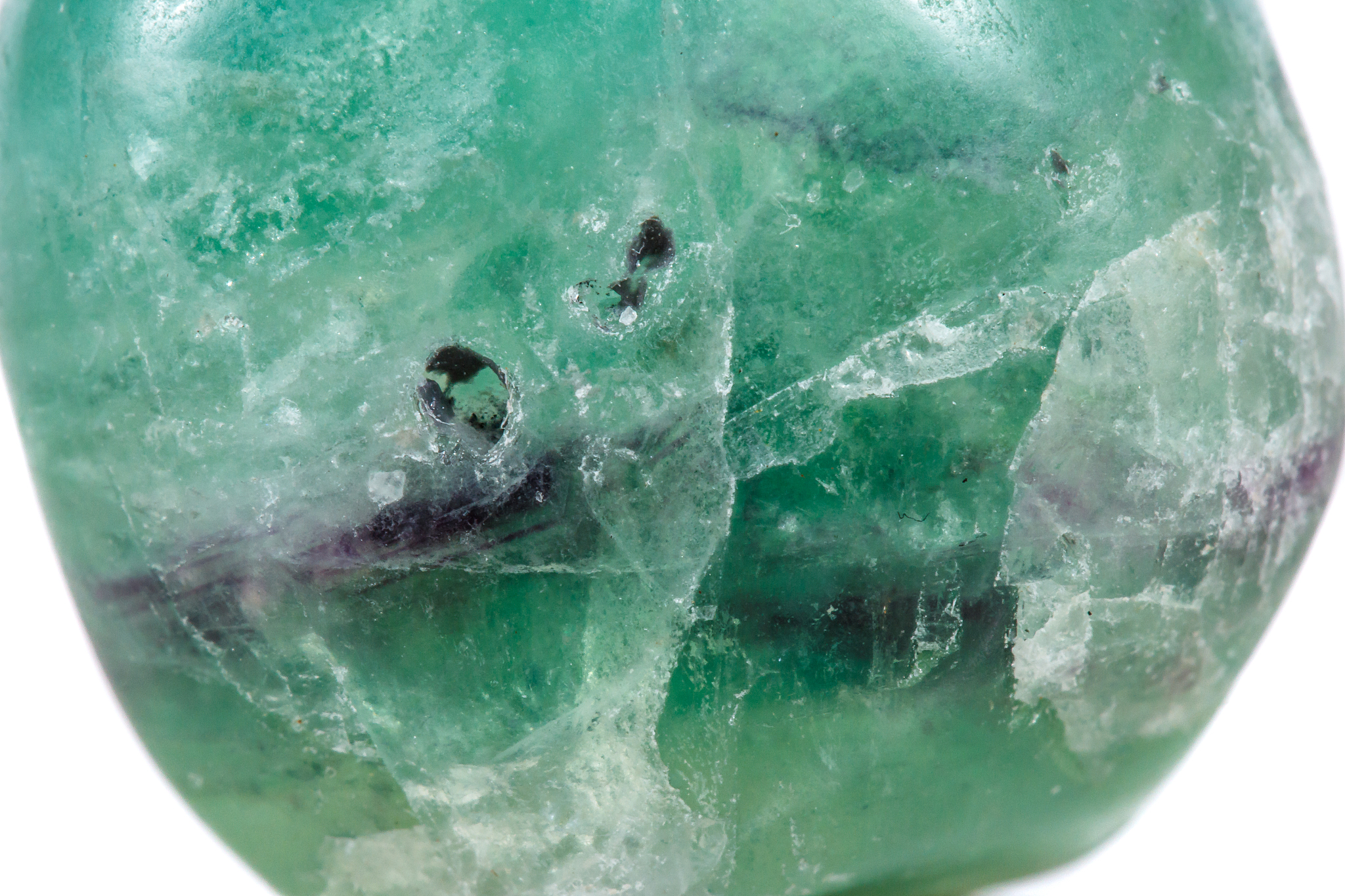 macro mineral stone fluorite crystal on a black background