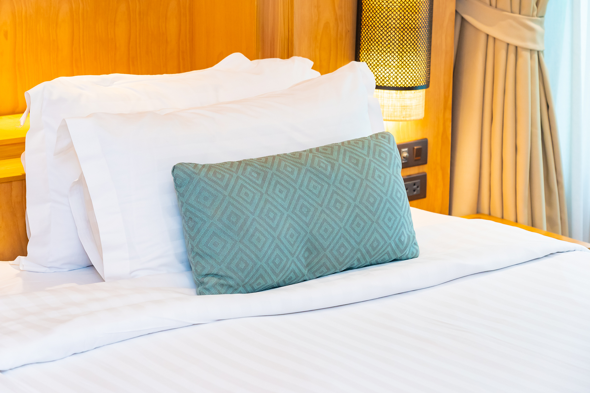 beautiful luxury comfortable white pillow blanket on bed decorat