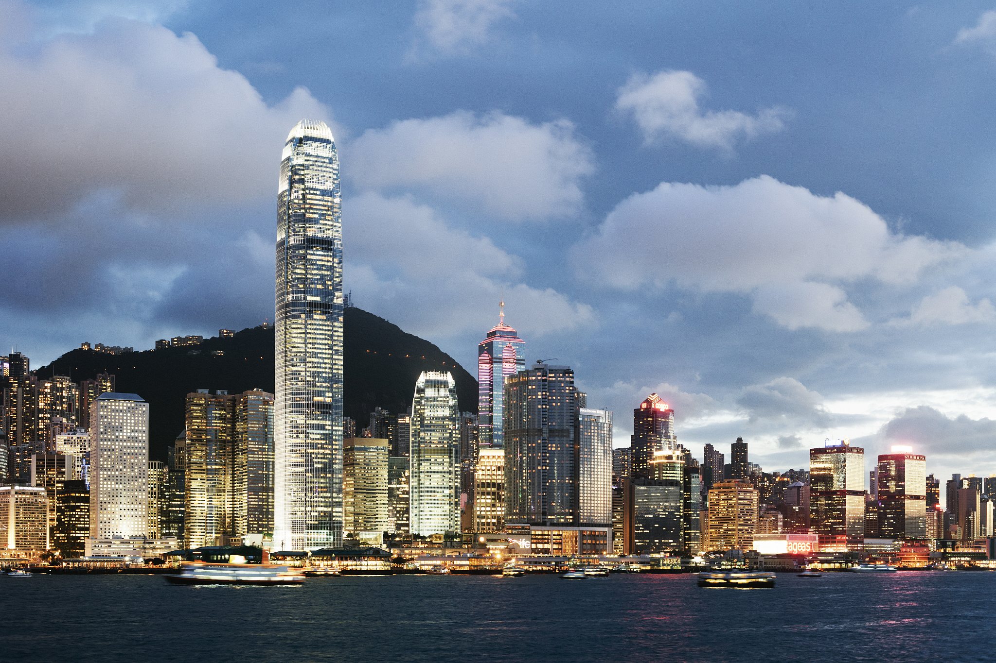 hong kong skyline illuminated at dusk