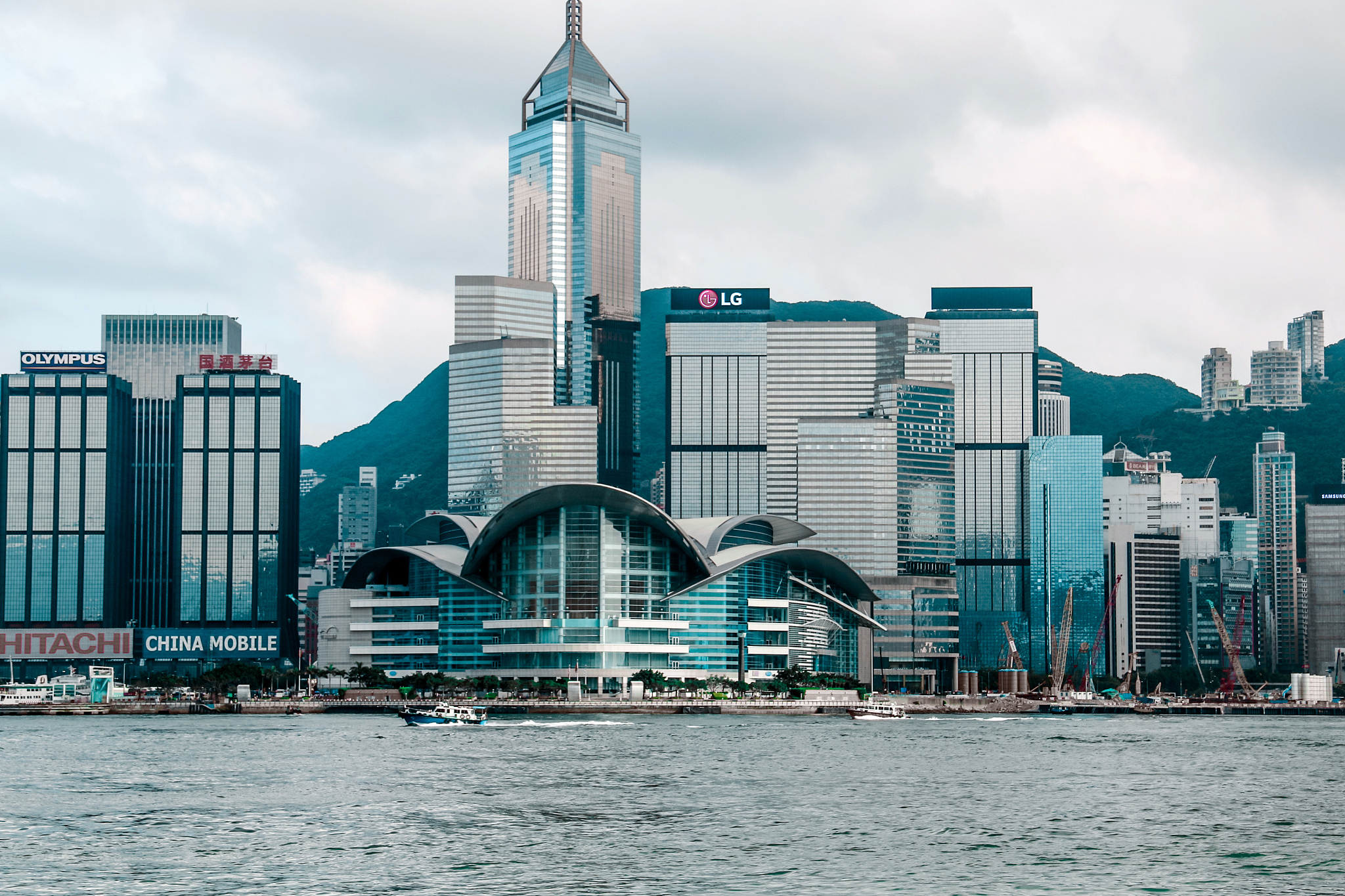 view of buildings in city against cloudy sky