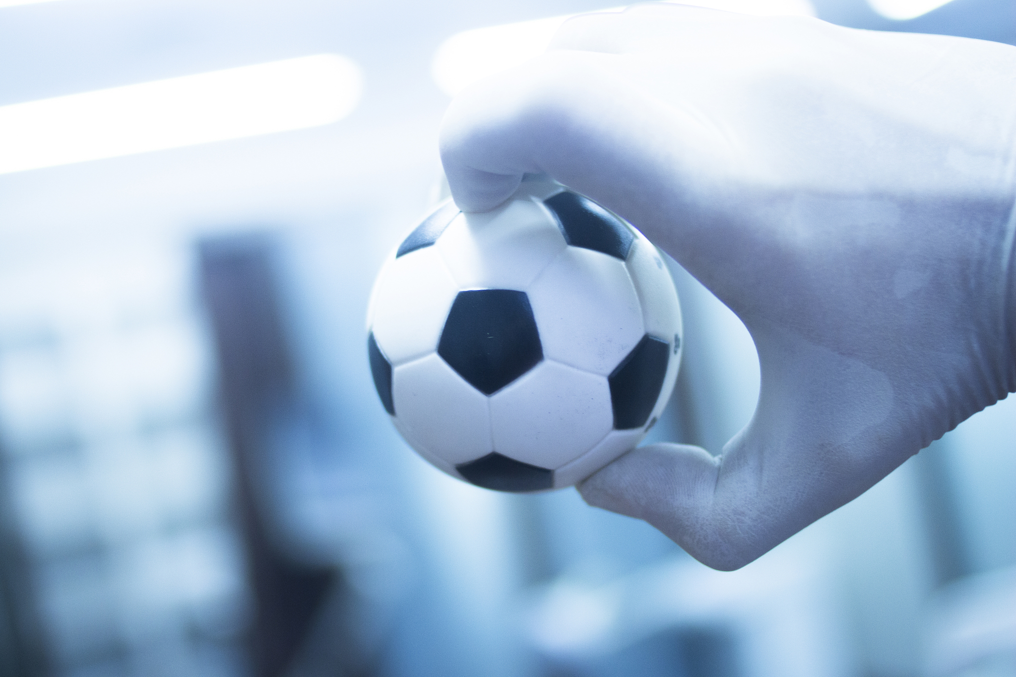 close-up of hand holding ball