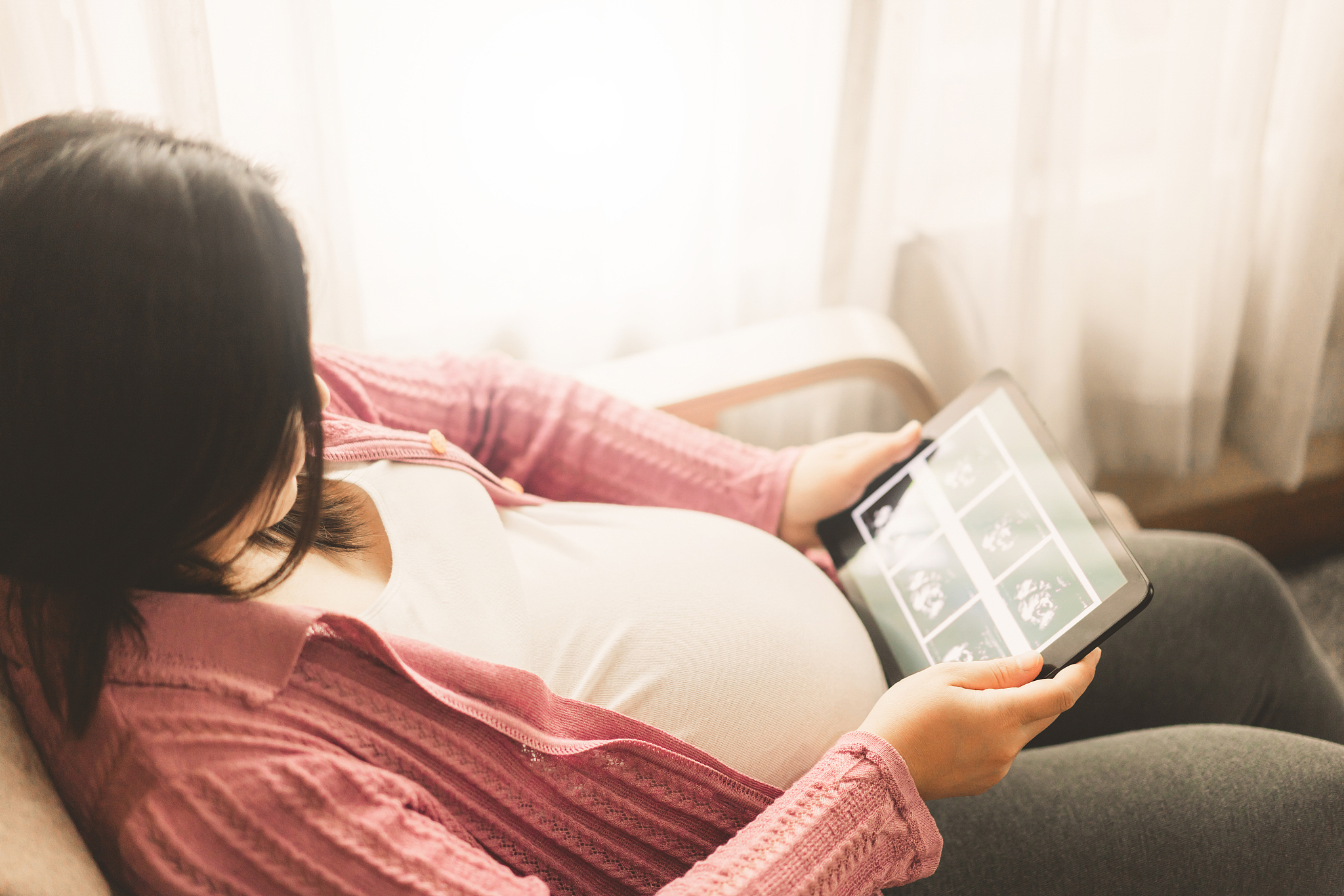 happy pregnant woman and expecting baby at home.