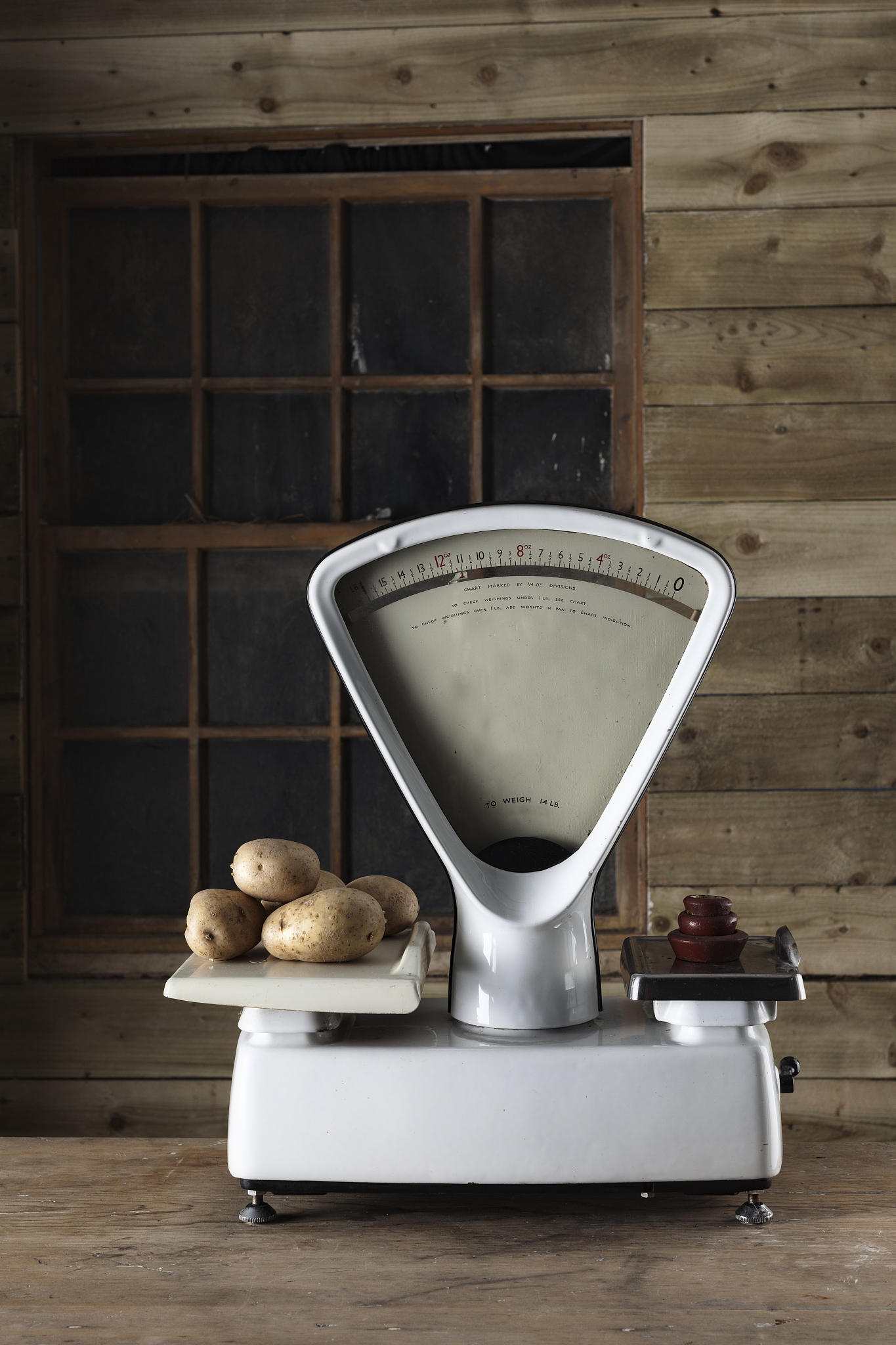 weighing potatoes on vintage scales
