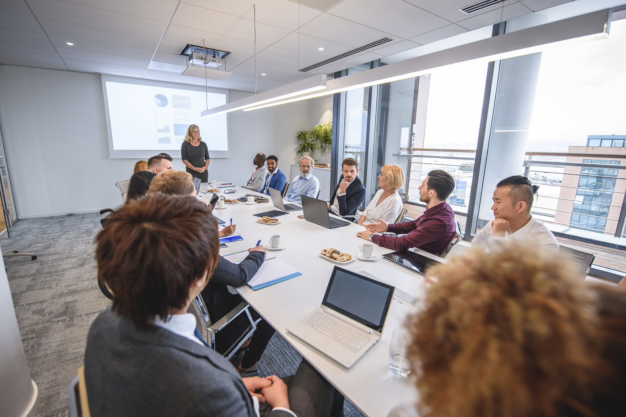 management team discussing presentation details