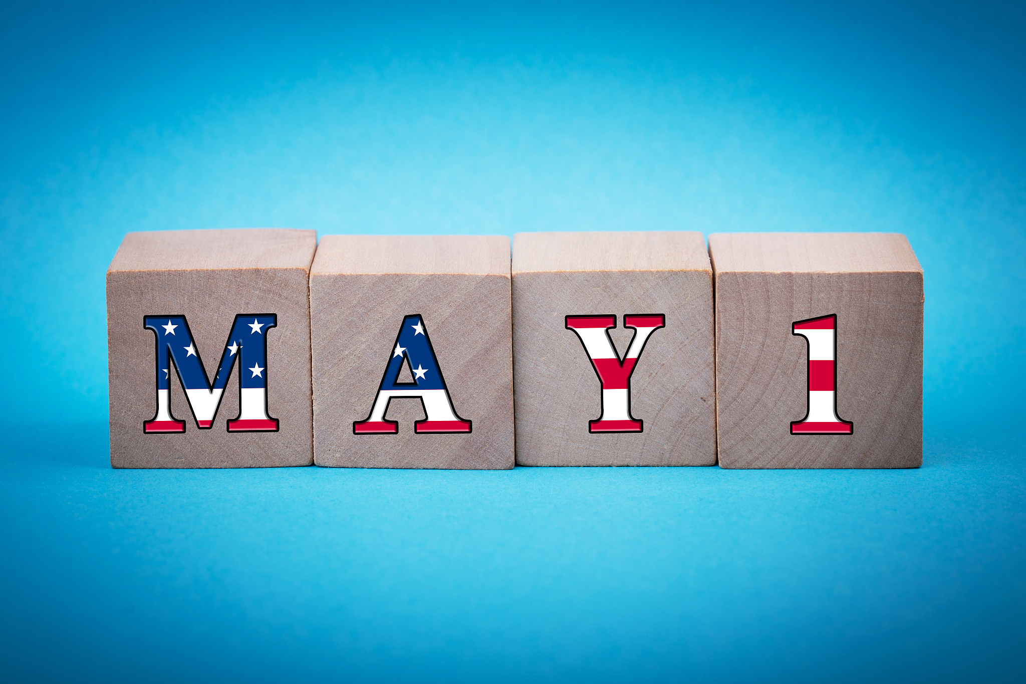 may 1 labor day concept wooden cube blocks