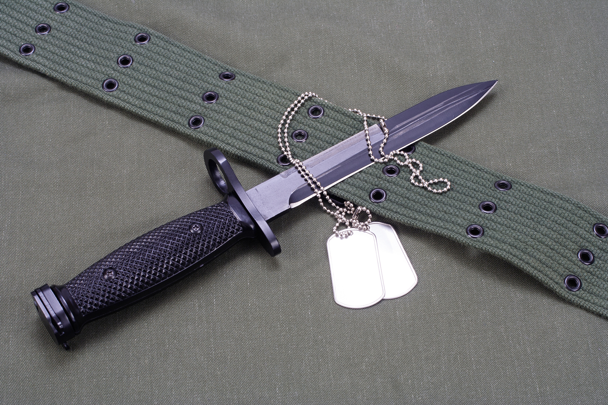 m16 rifle bayonet on uniform background
