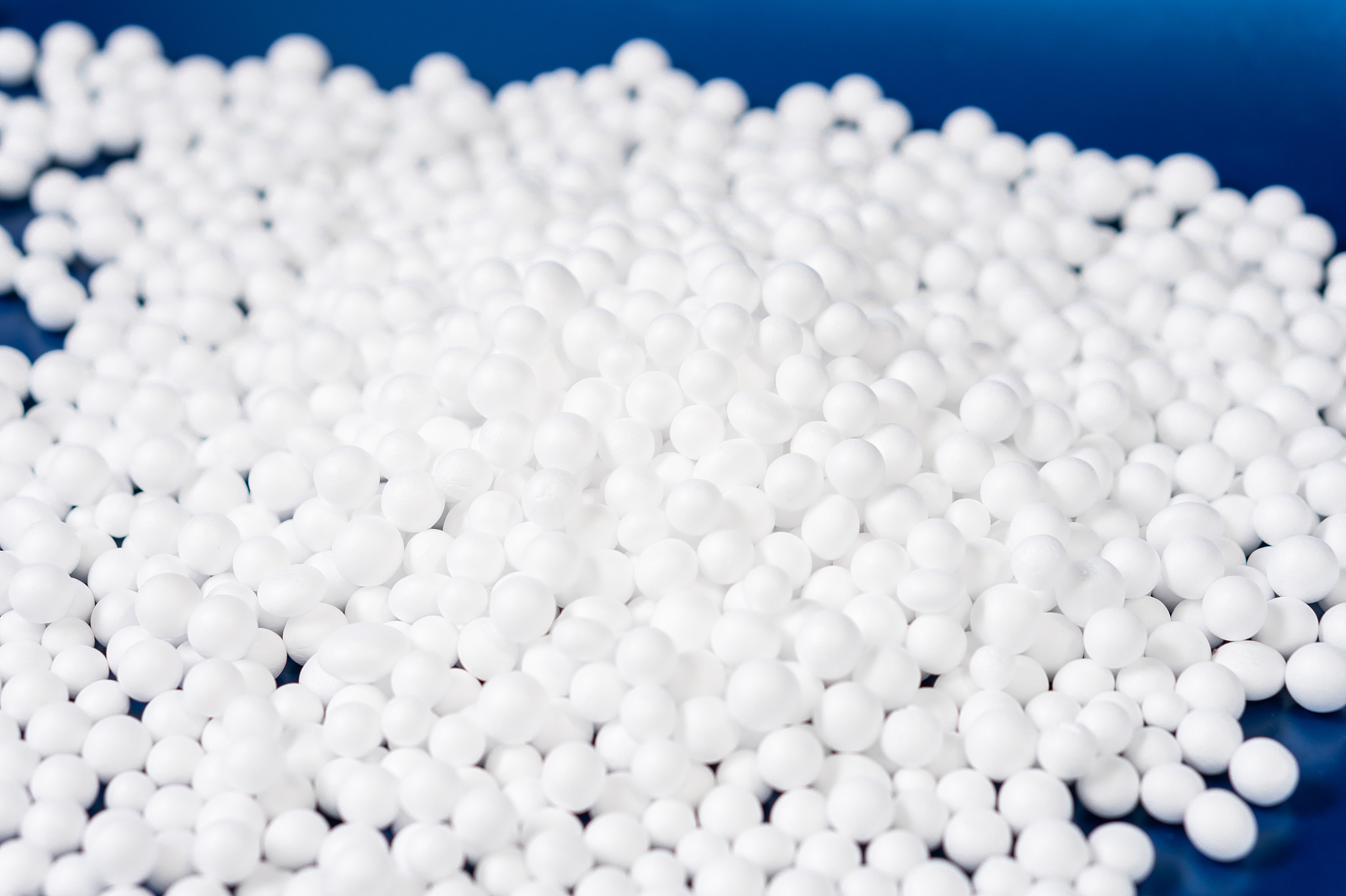 white polystyrene foam beads ball drop from styrofoam machine