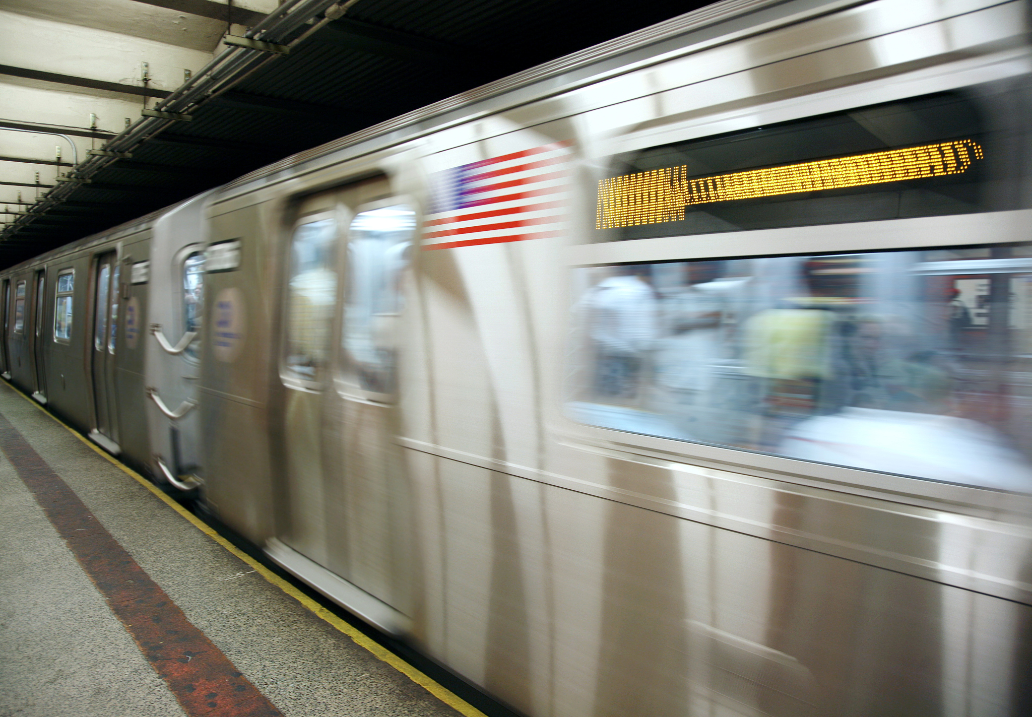subway train in station, blurred motion