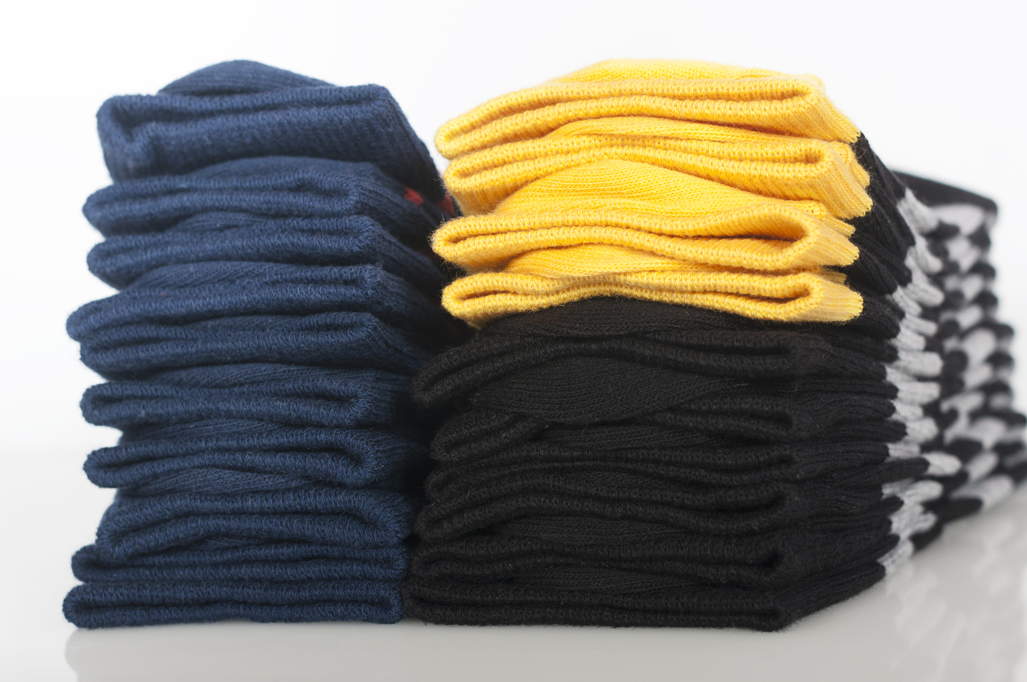 two stacks of different socks