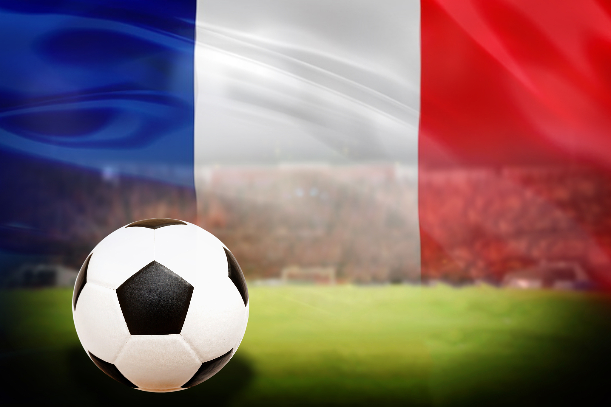 soccer ball on green field of football stadium and stadium