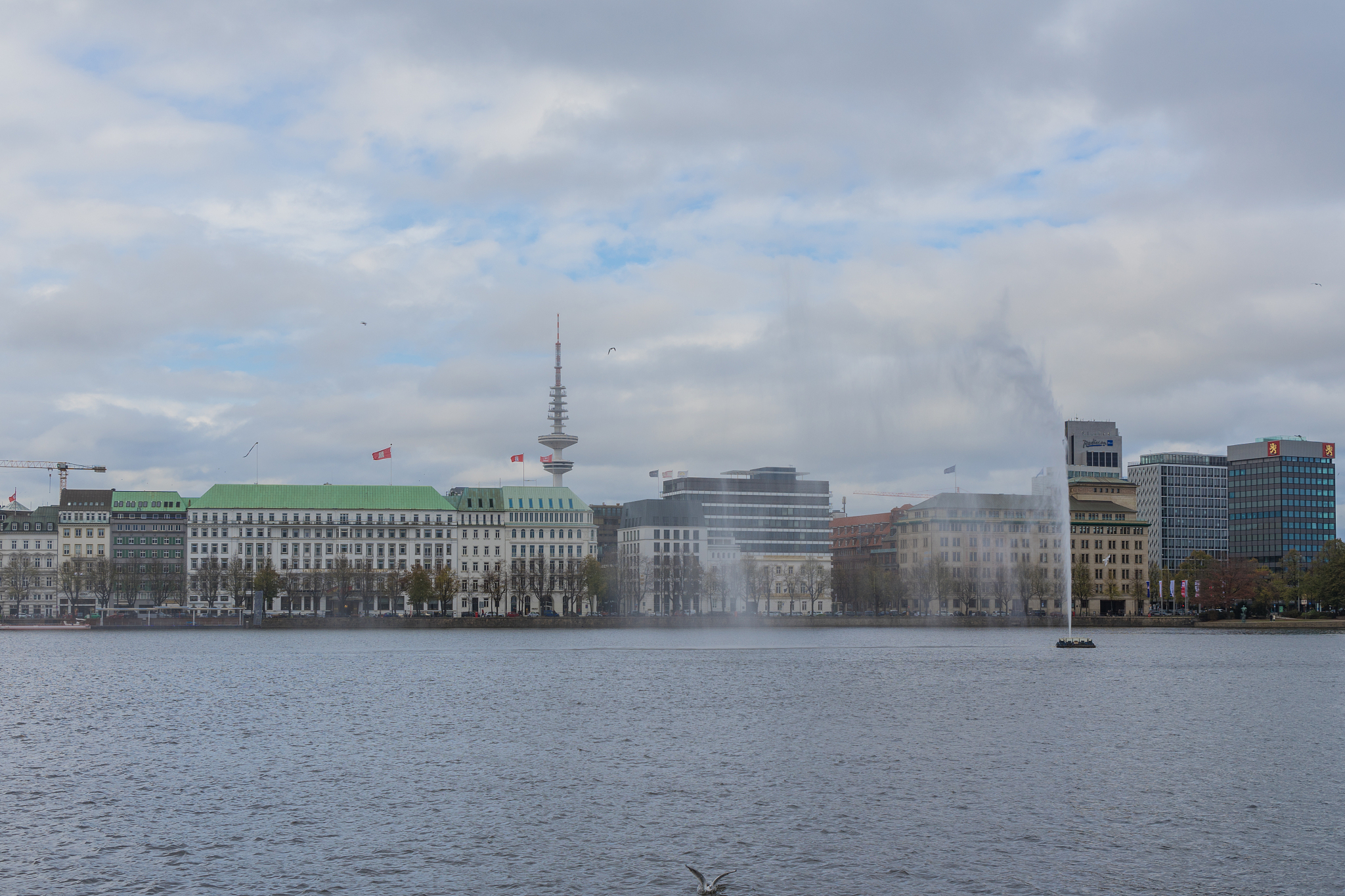 lake binnenalster with the alster fountain in hamburg - germany