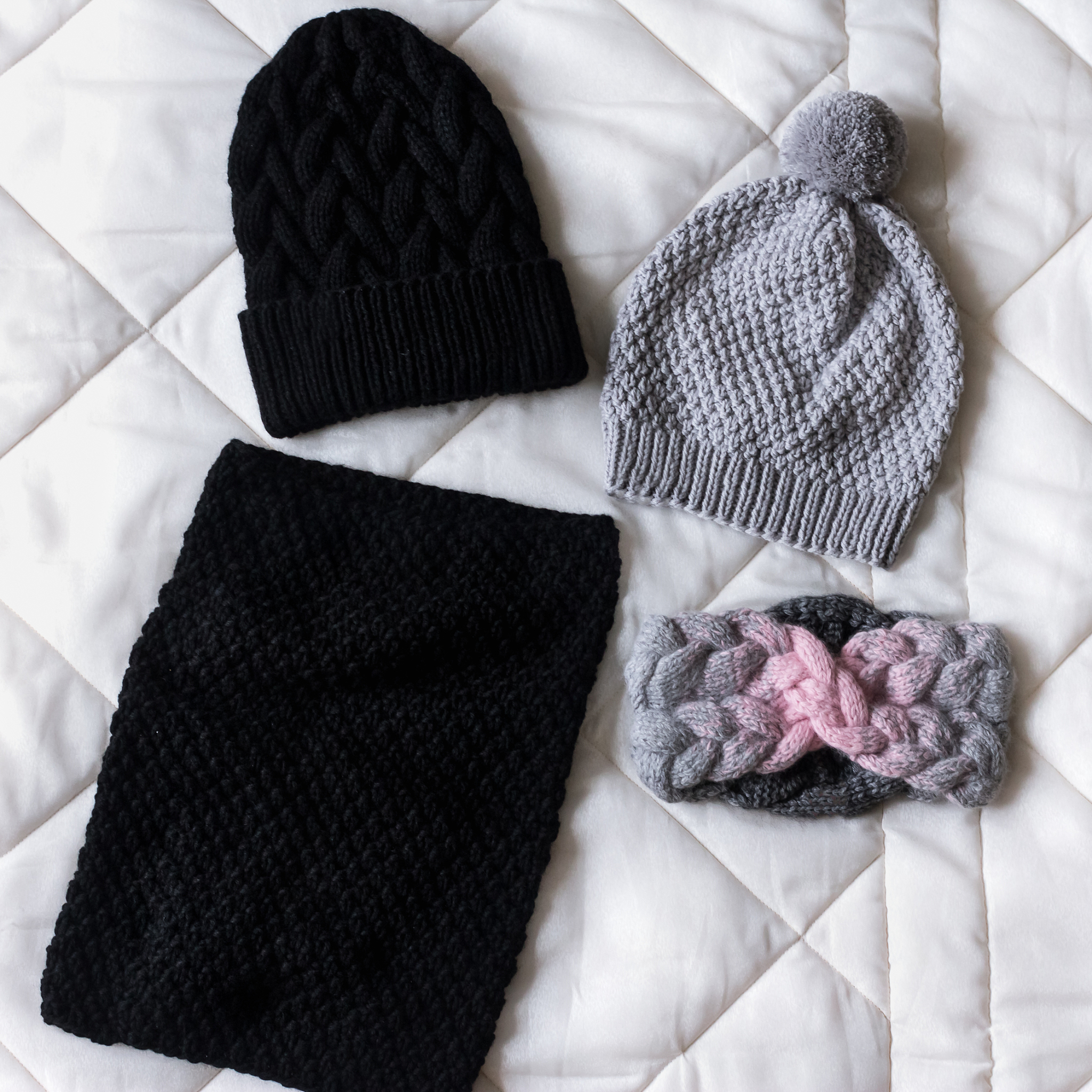 winter accessory collection. hat, scarf and mittens, on white ba