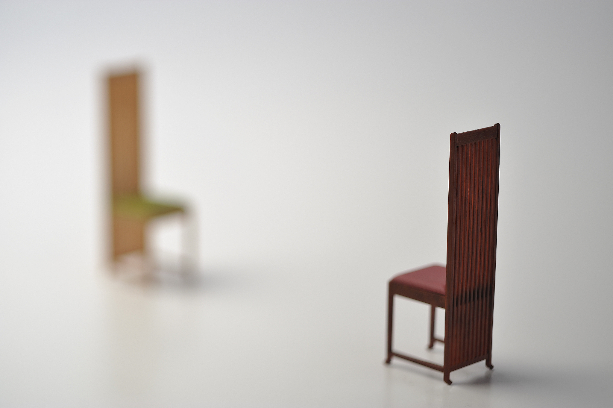 two miniature chairs
