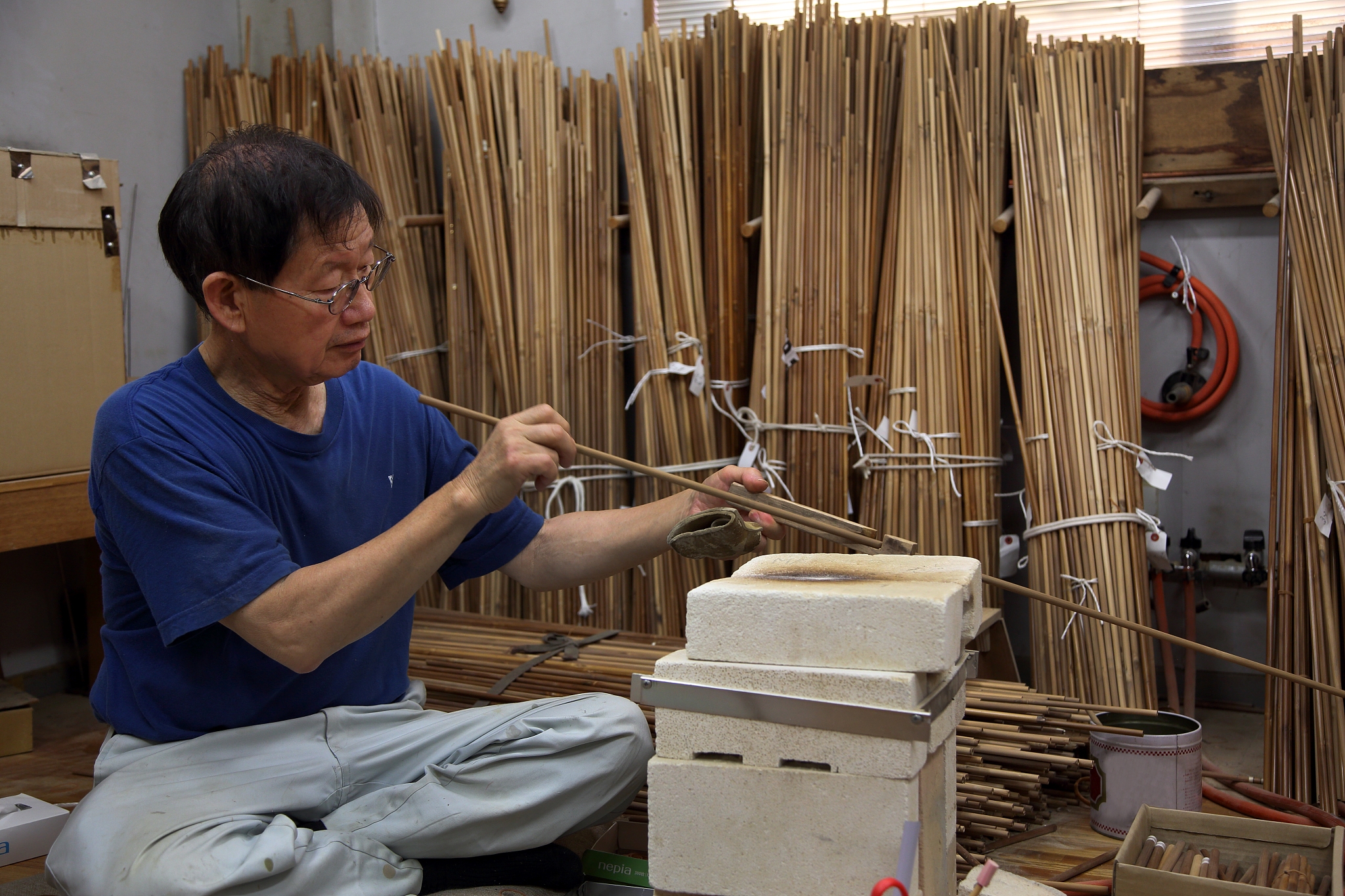 a japanese man making japanese a japanese arrow