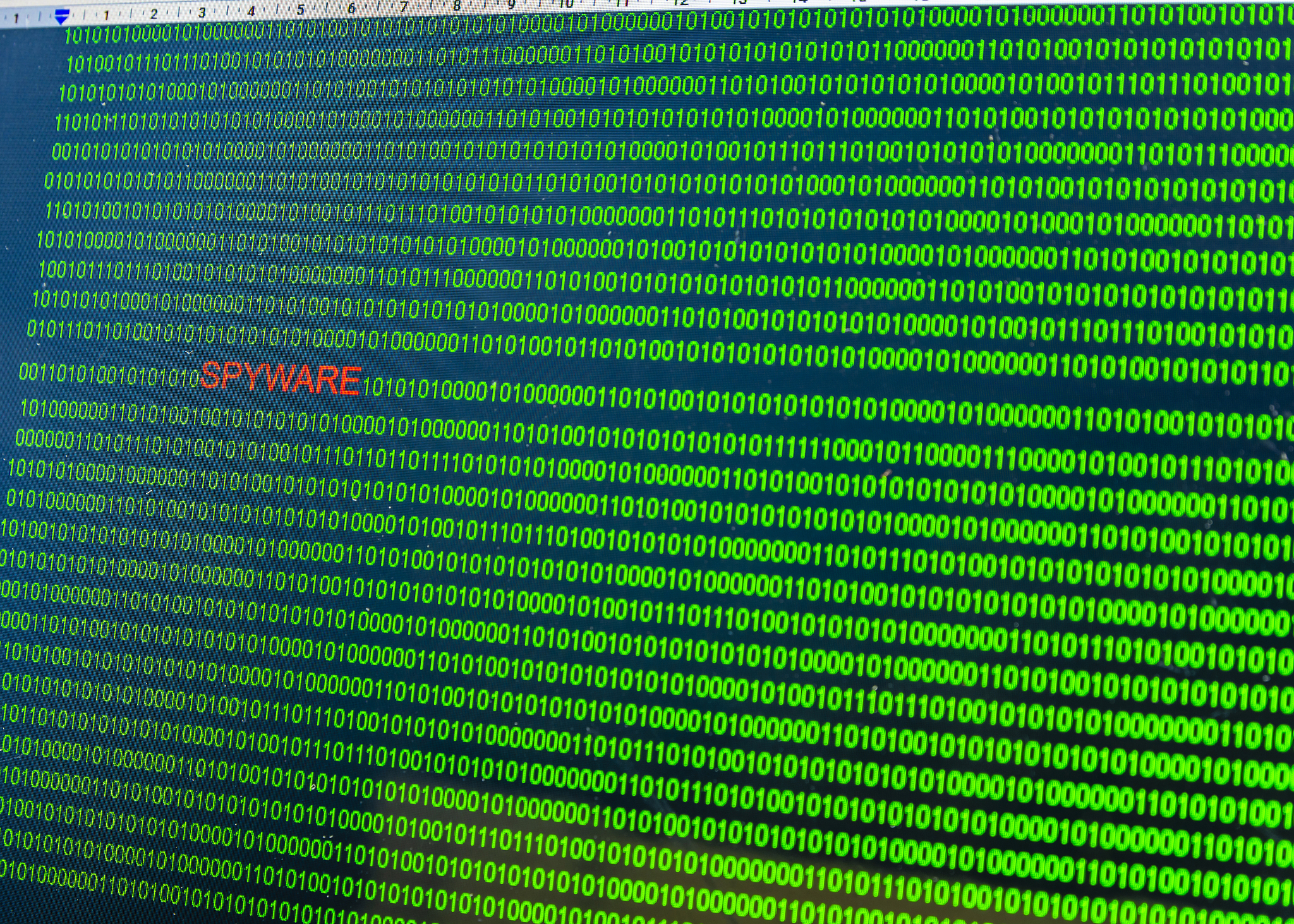red inscription spyware in malicious computer code written by a 