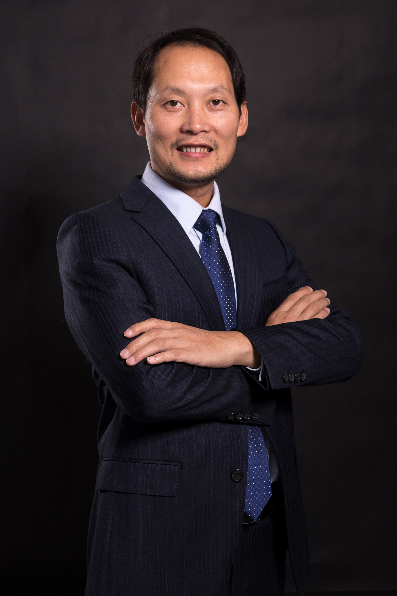young asian businessman on black background