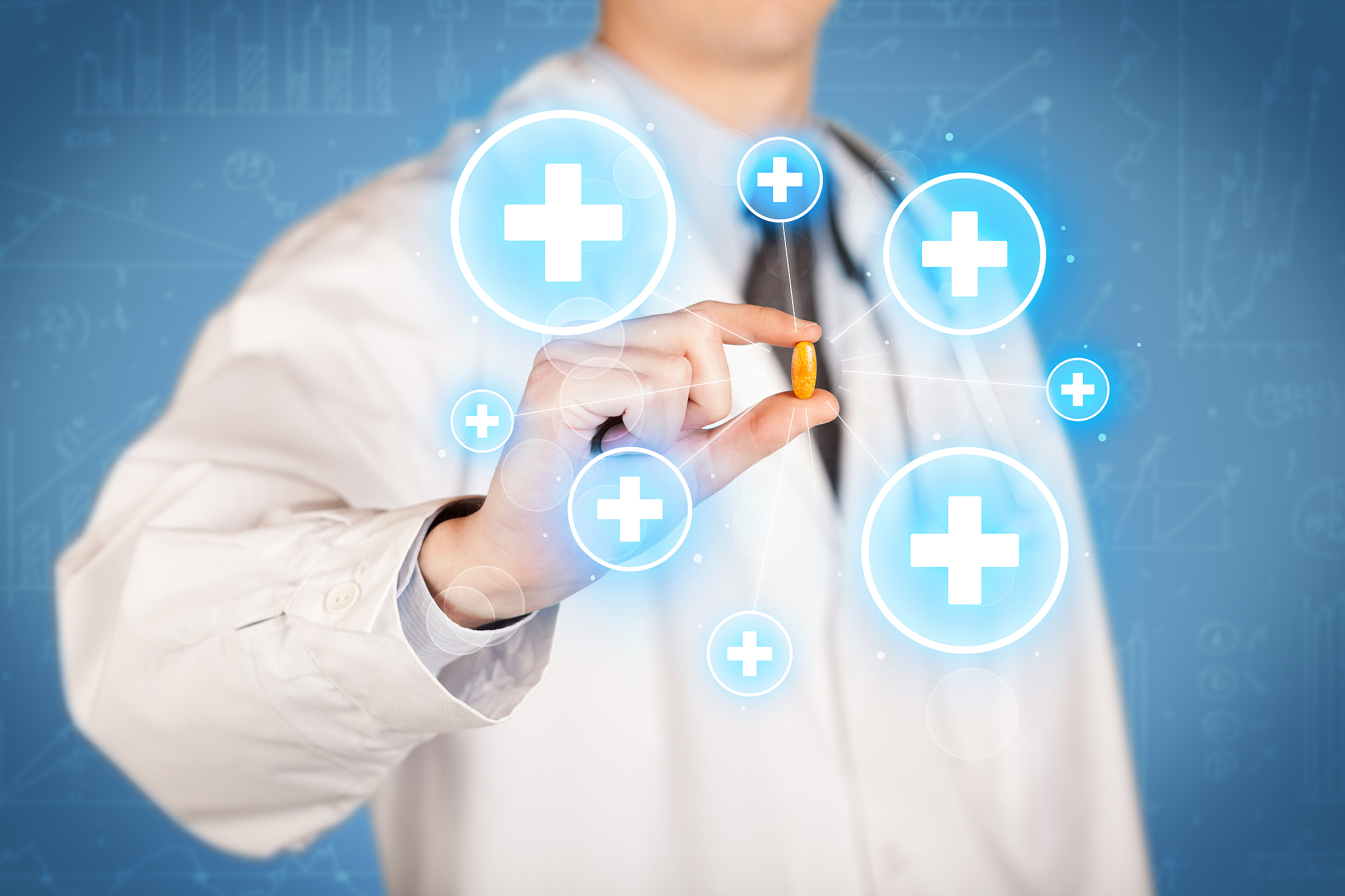 a doctor showing a pill with crosses