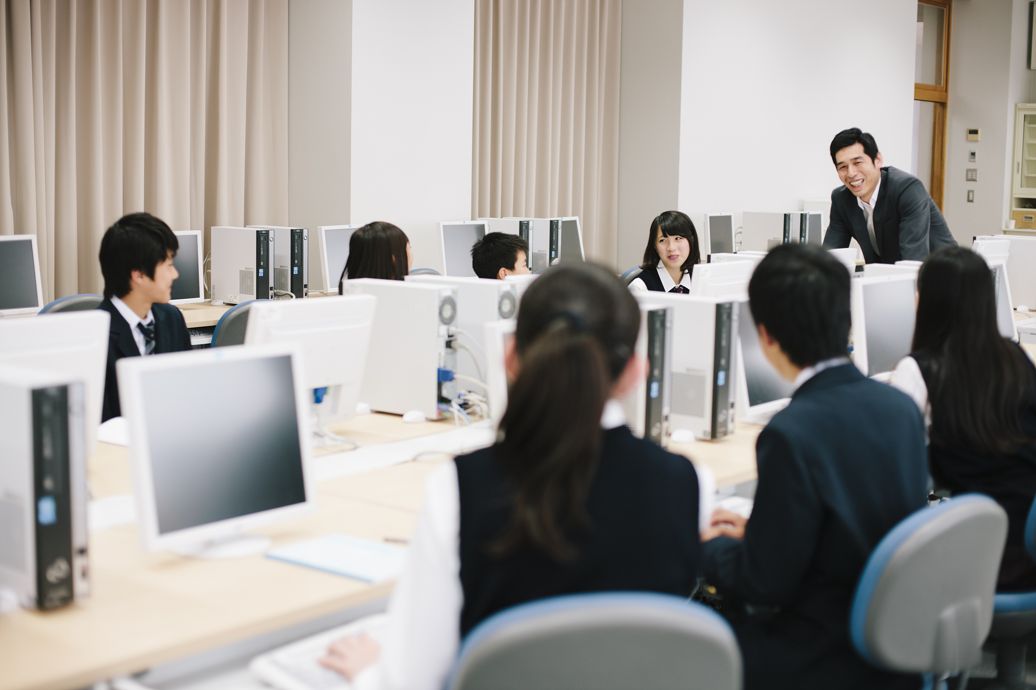 high school class and teacher in a computer laboratory, japan