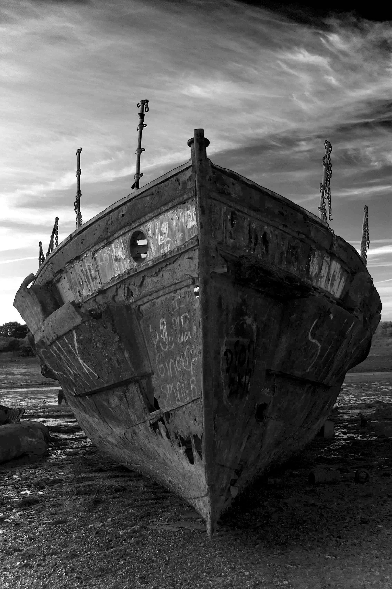 low angle view of old boat moored on land