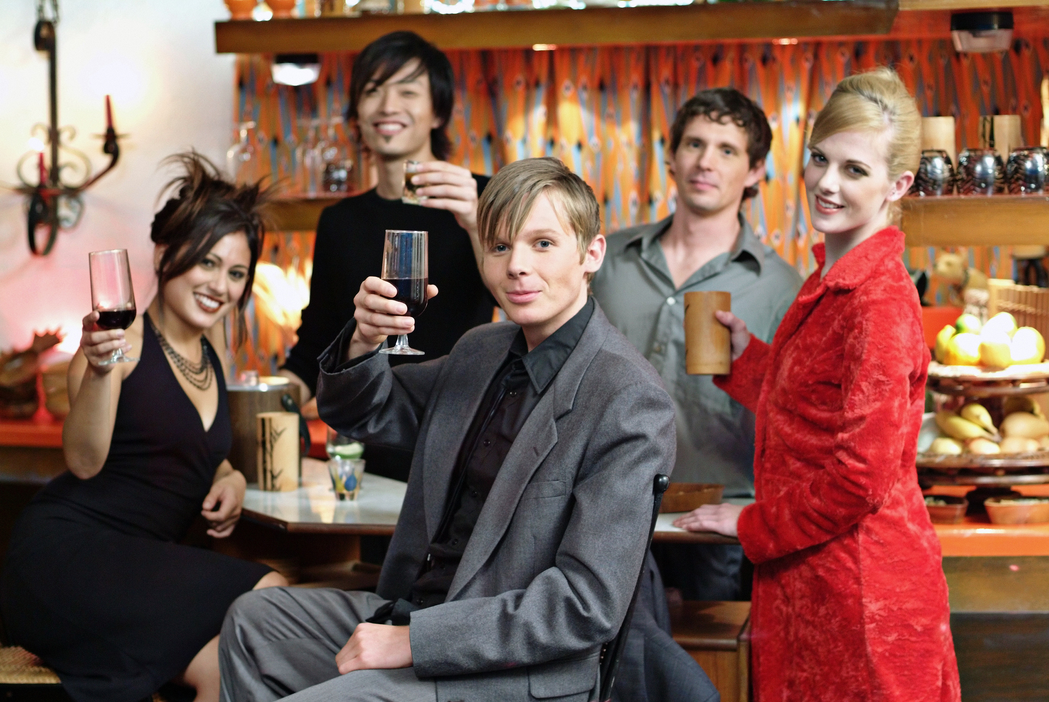 friends toasting in a bar