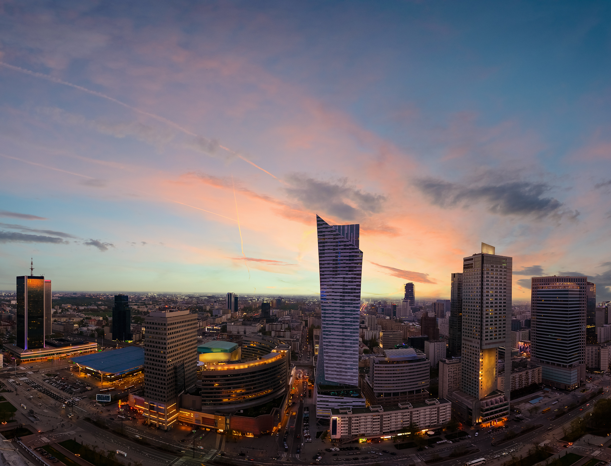 panorama of warsaw city with modern skyscraper in sunset time