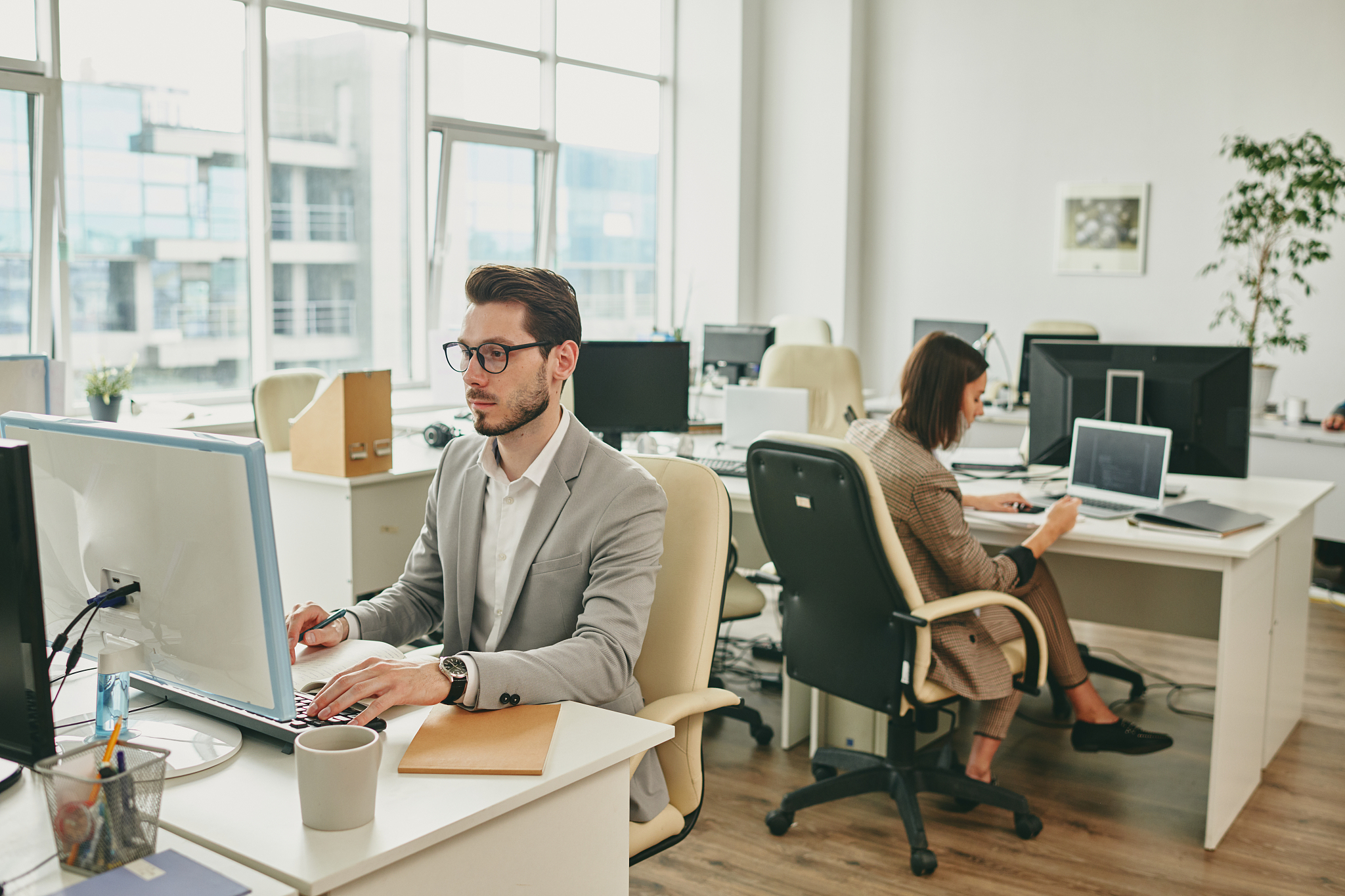 two people working in office