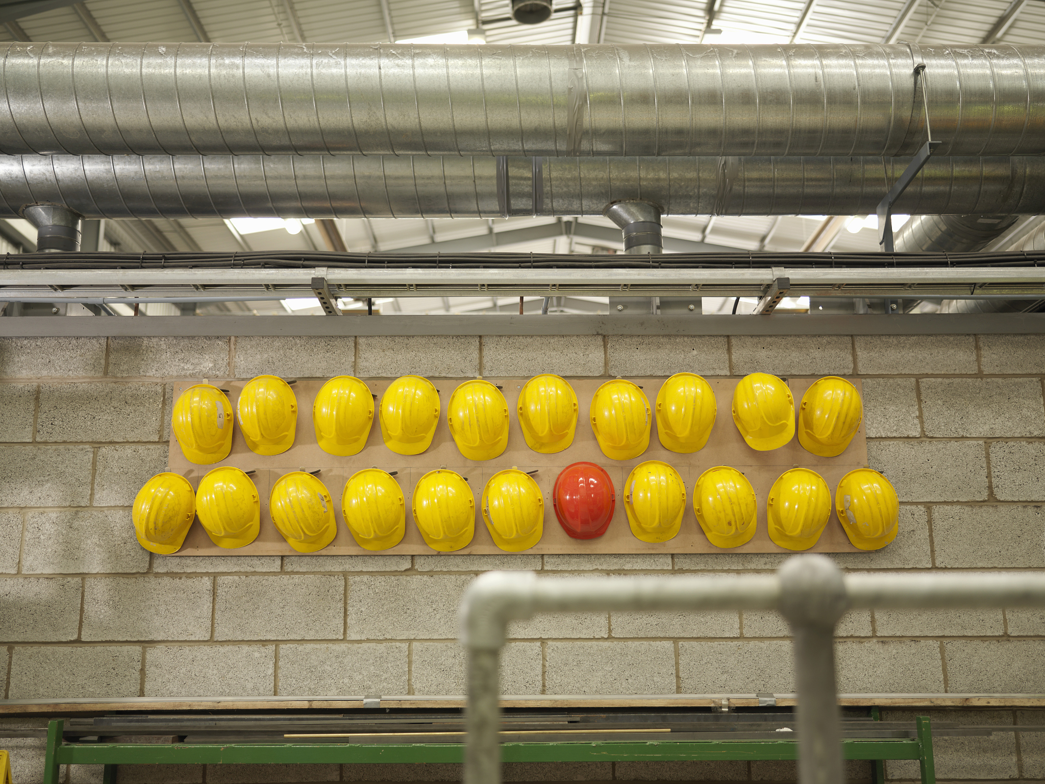 rows of yellow and red hard hats