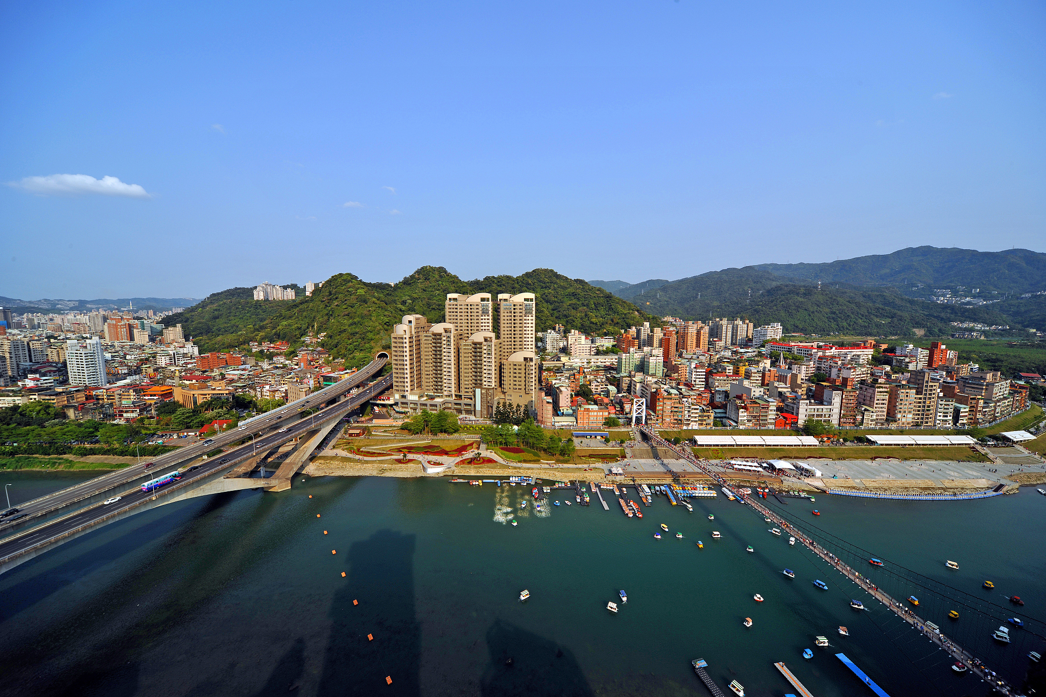 high angle view of cityscape against clear blue sky