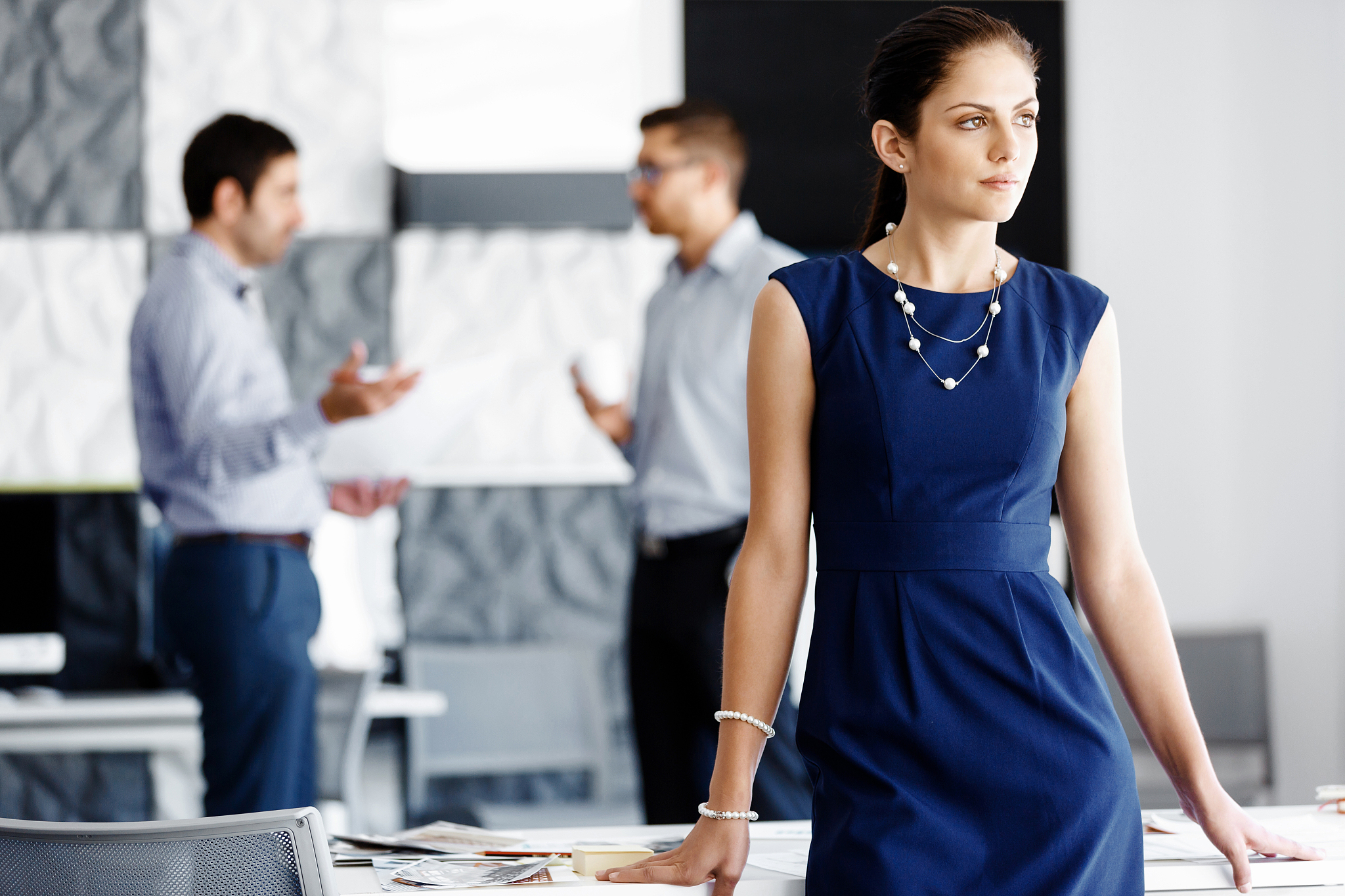 attractive office worker standing. attractive woman standing in 