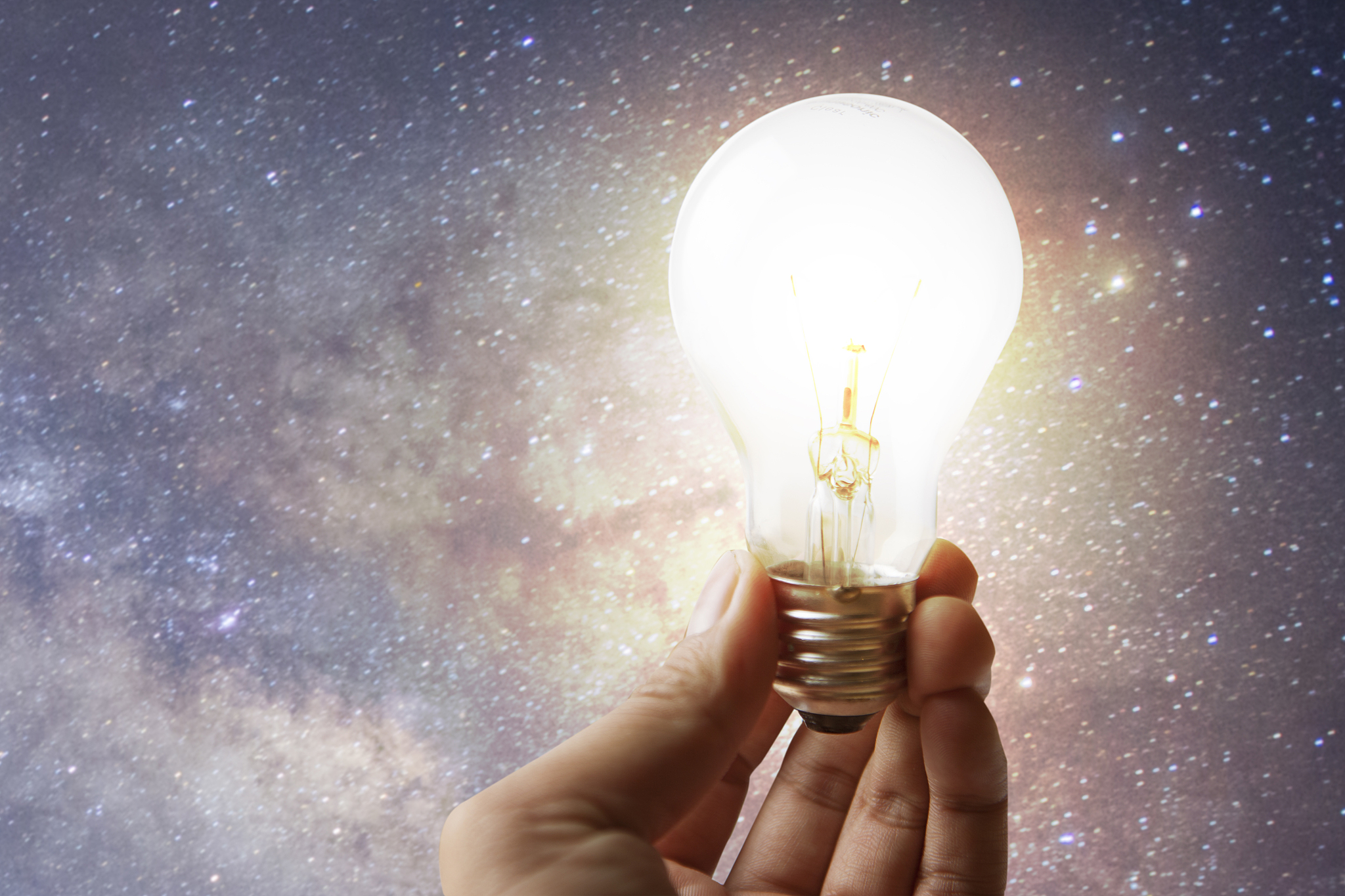 hand holding lighting bulb for creative or design something