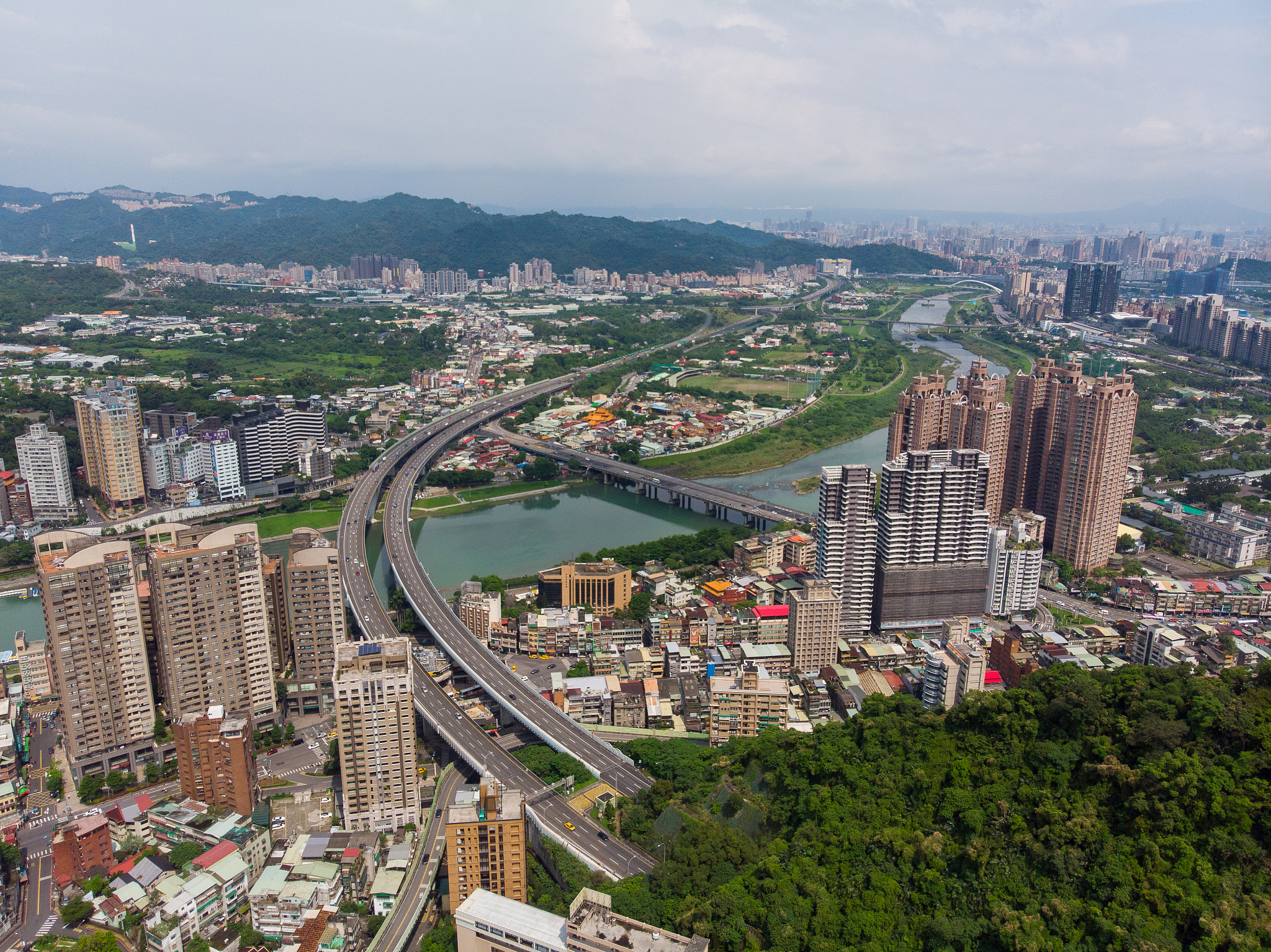 high angle view of buildings in city against sky