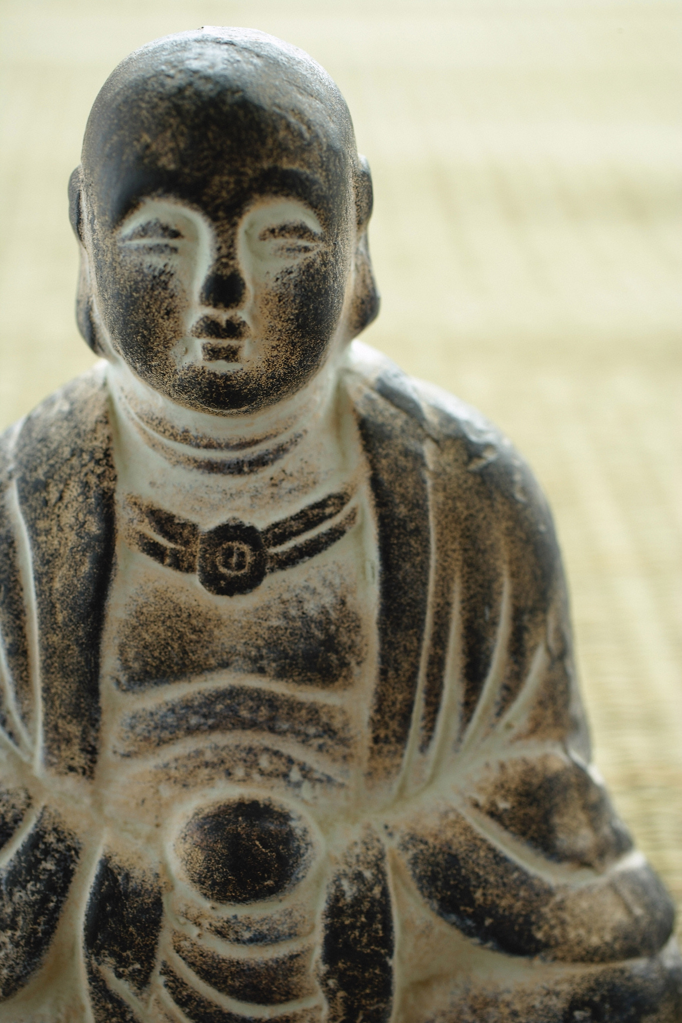 close-up of small buddha sculpture
