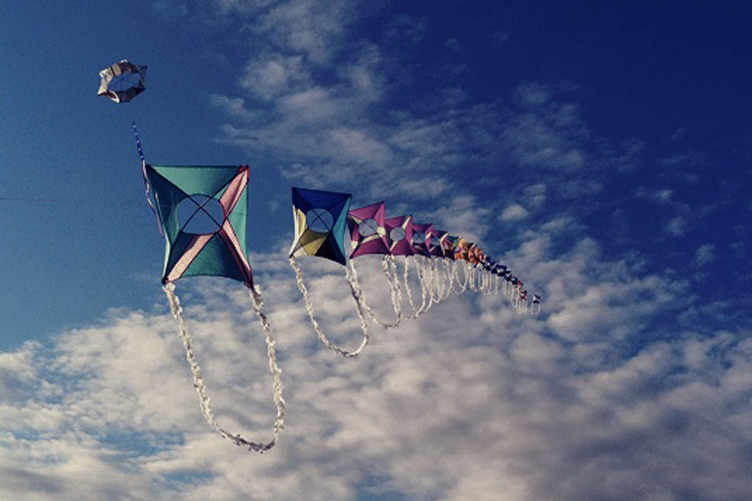 low angle view of kites blue sky and clouds