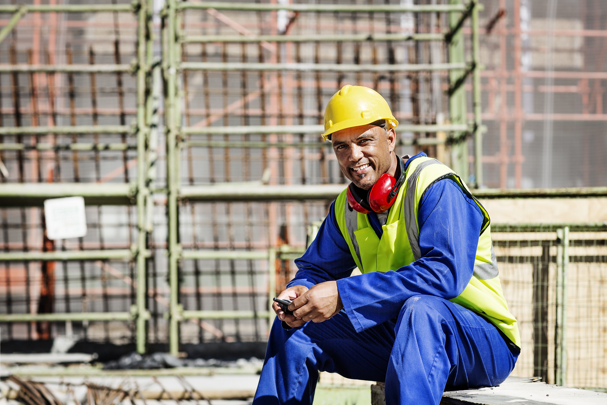 portrait of happy construction worker at site